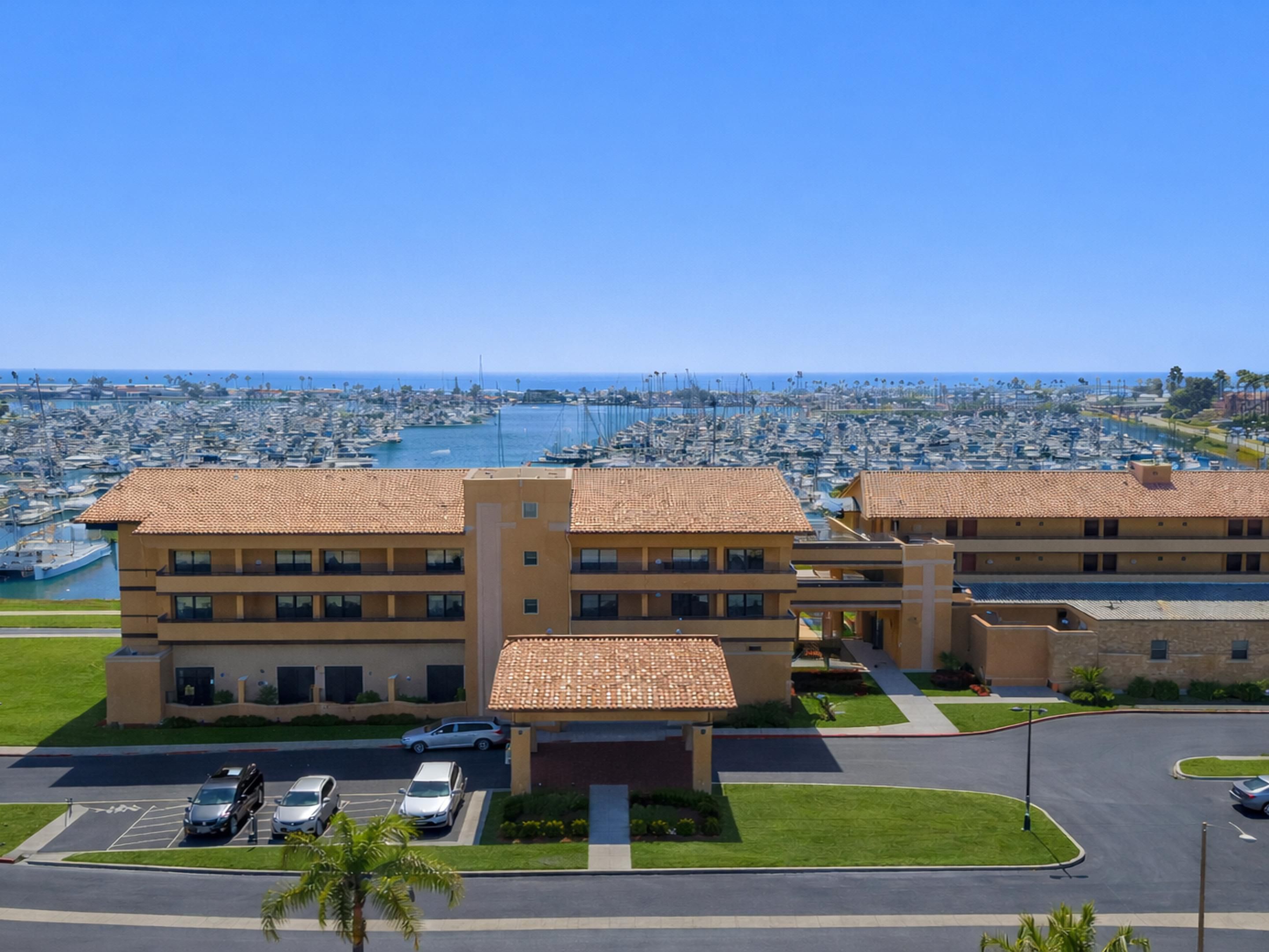 Aerial view of hotel with ocean and harbor backdrop!