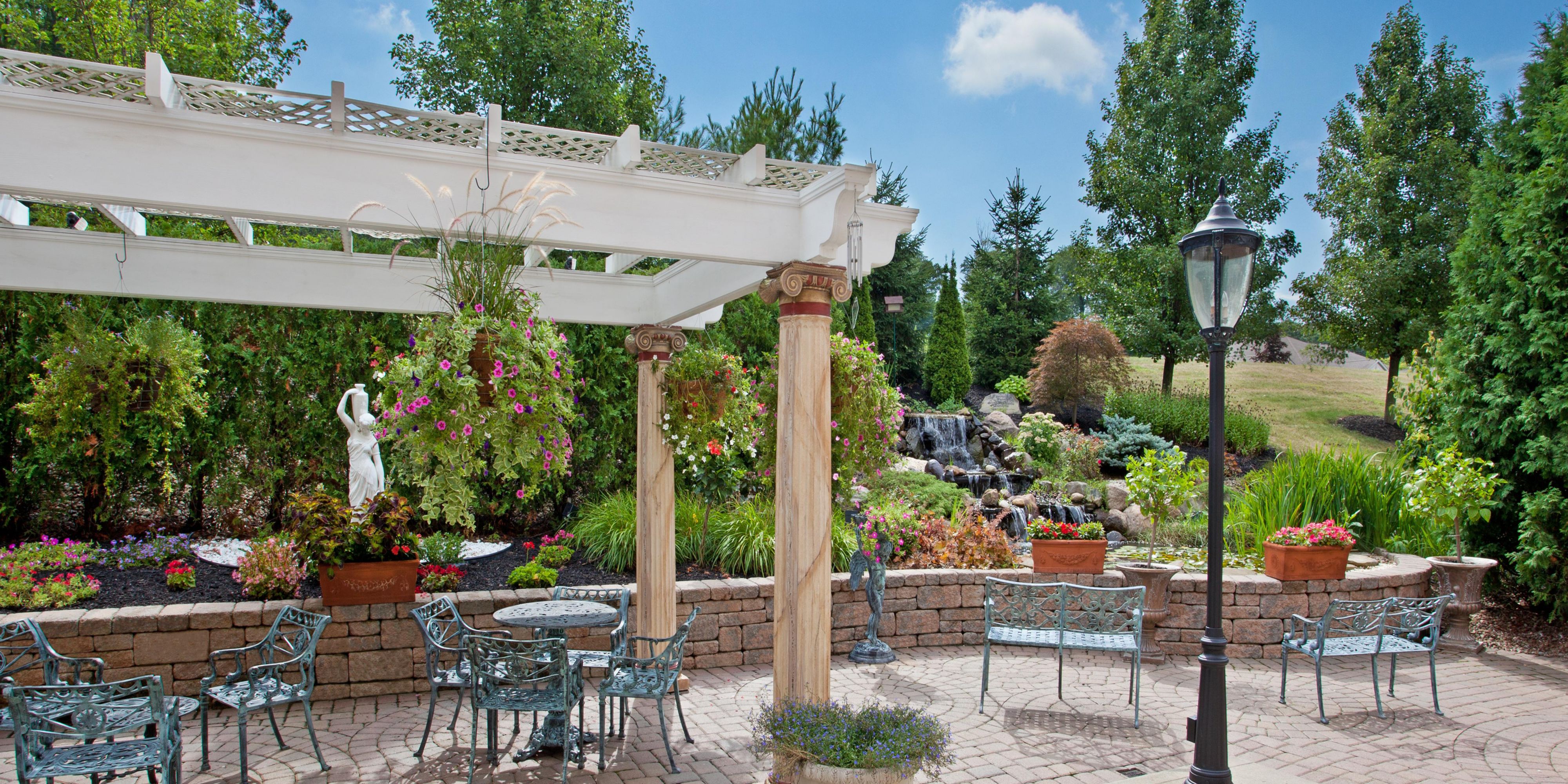 Enjoy some downtime on our picturesque patio featuring a waterfall and koi pond. 