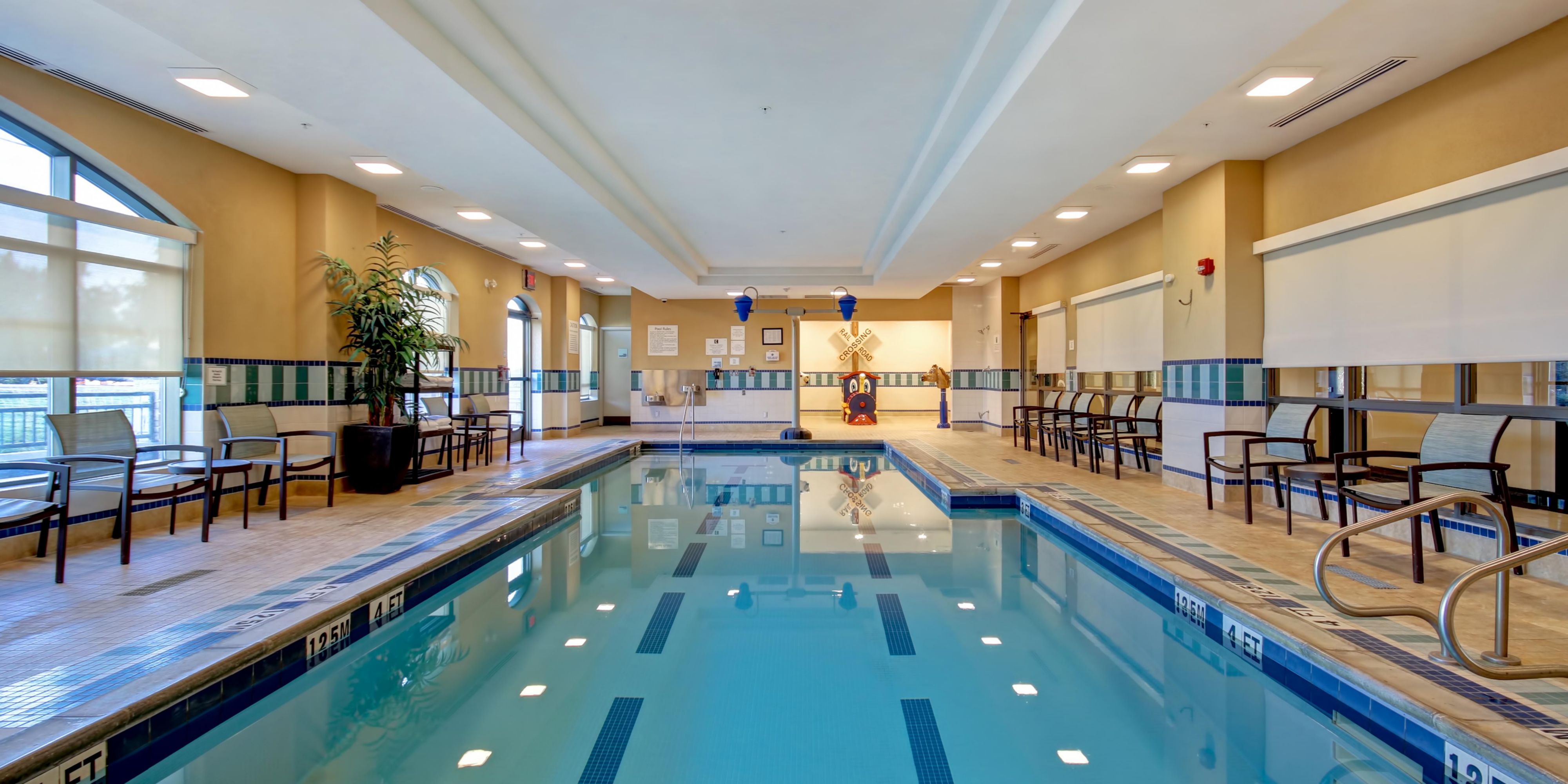 Our Indoor Heated Pool and Splash Pad with Dumping Buckets is perfect for families and open daily from 6:00am-10:00pm. Reservations are required.