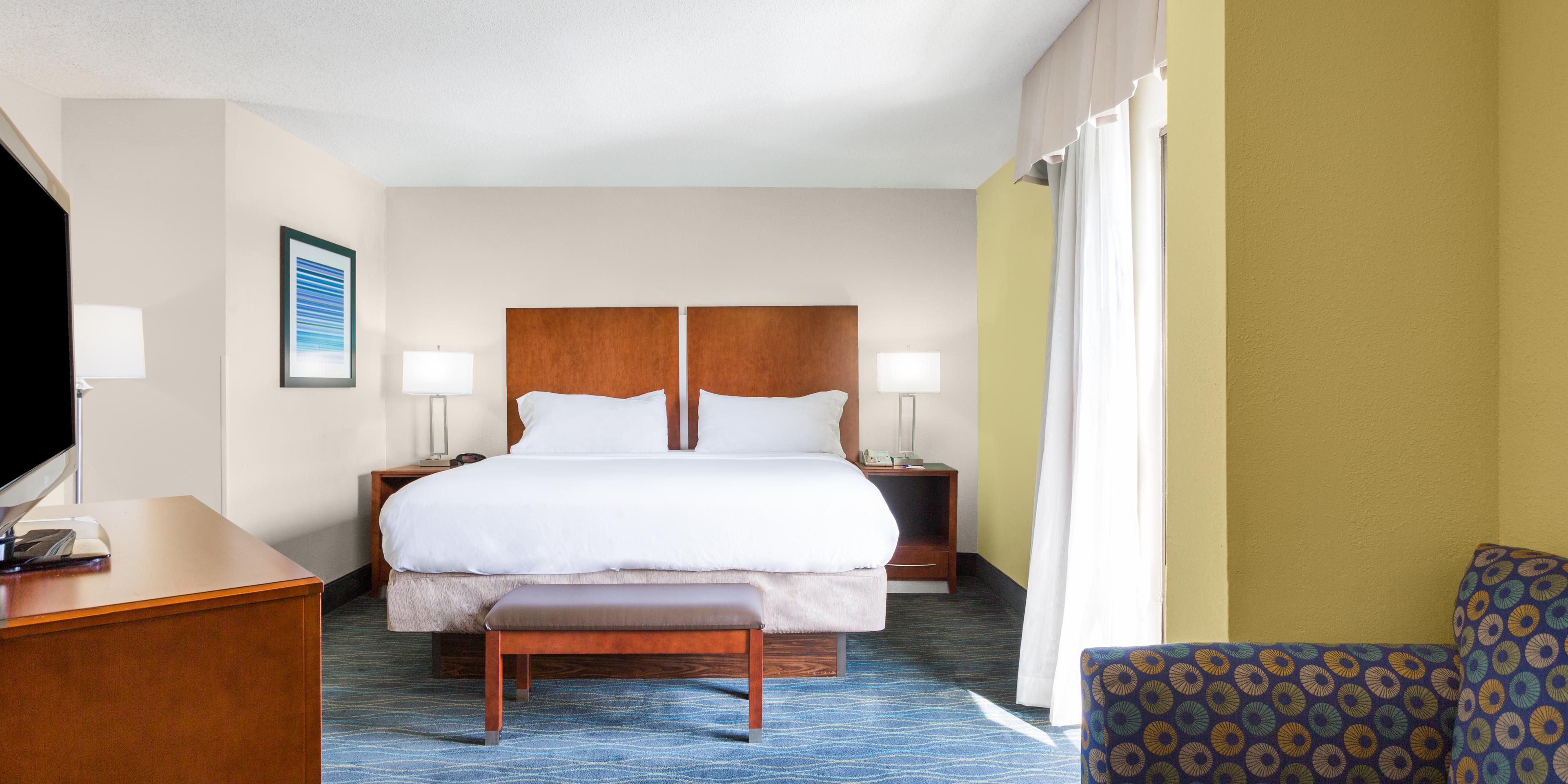 Our hotel in Wilmington, NC features many different room types including two varieties of suites - the Executive Suite and the Imperial Suite. Although configured differently, they both feature a king size bed with a separate living room area and kitchenette.