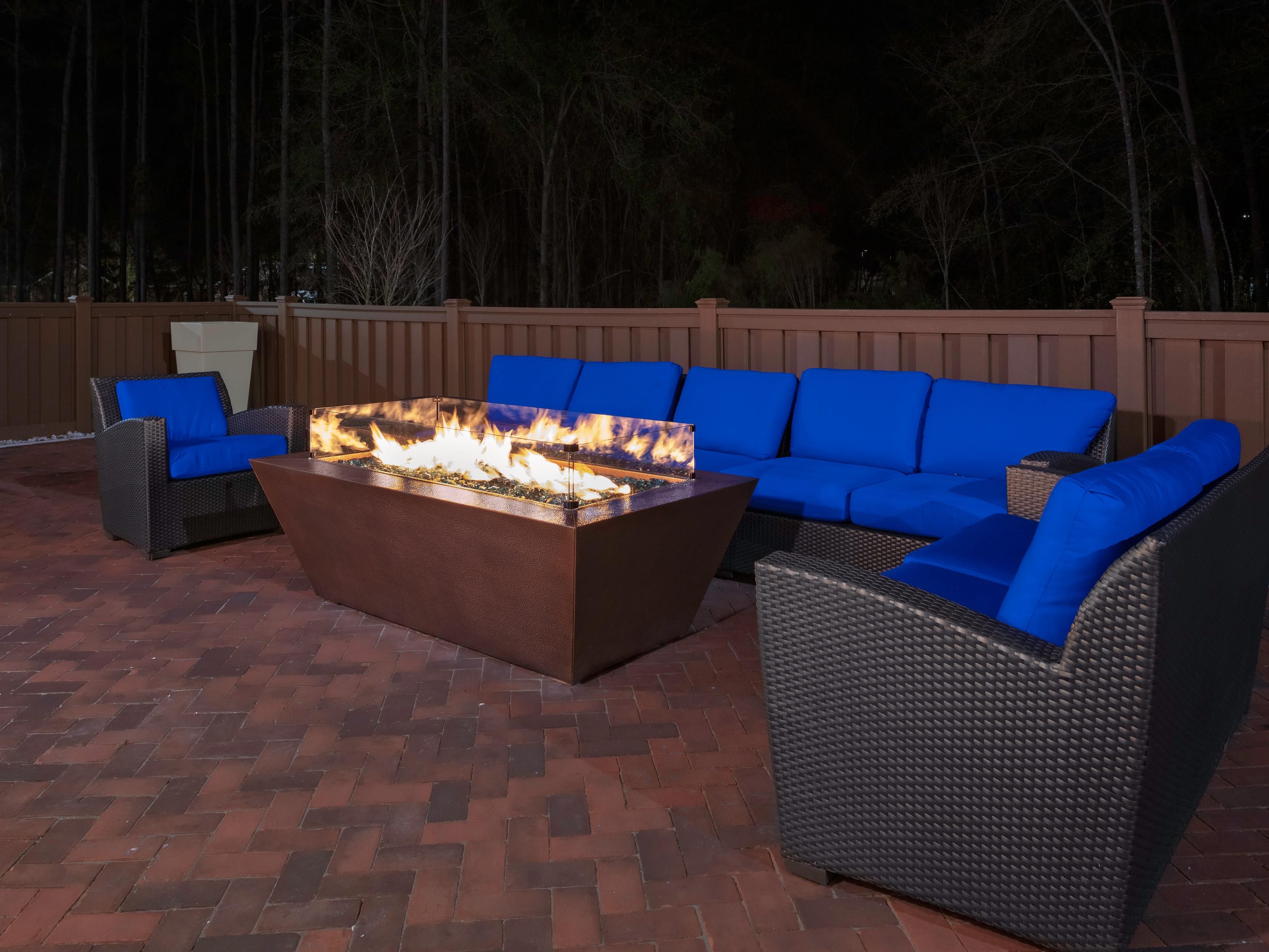 In the evening, guests can gather around our custom-made hammered copper fire pit, where the warmth of the crackling fire creates a cozy, inviting atmosphere. It’s the perfect spot to relax, unwind, and enjoy good company, capturing the communal and welcoming spirit of Wilmington, NC.