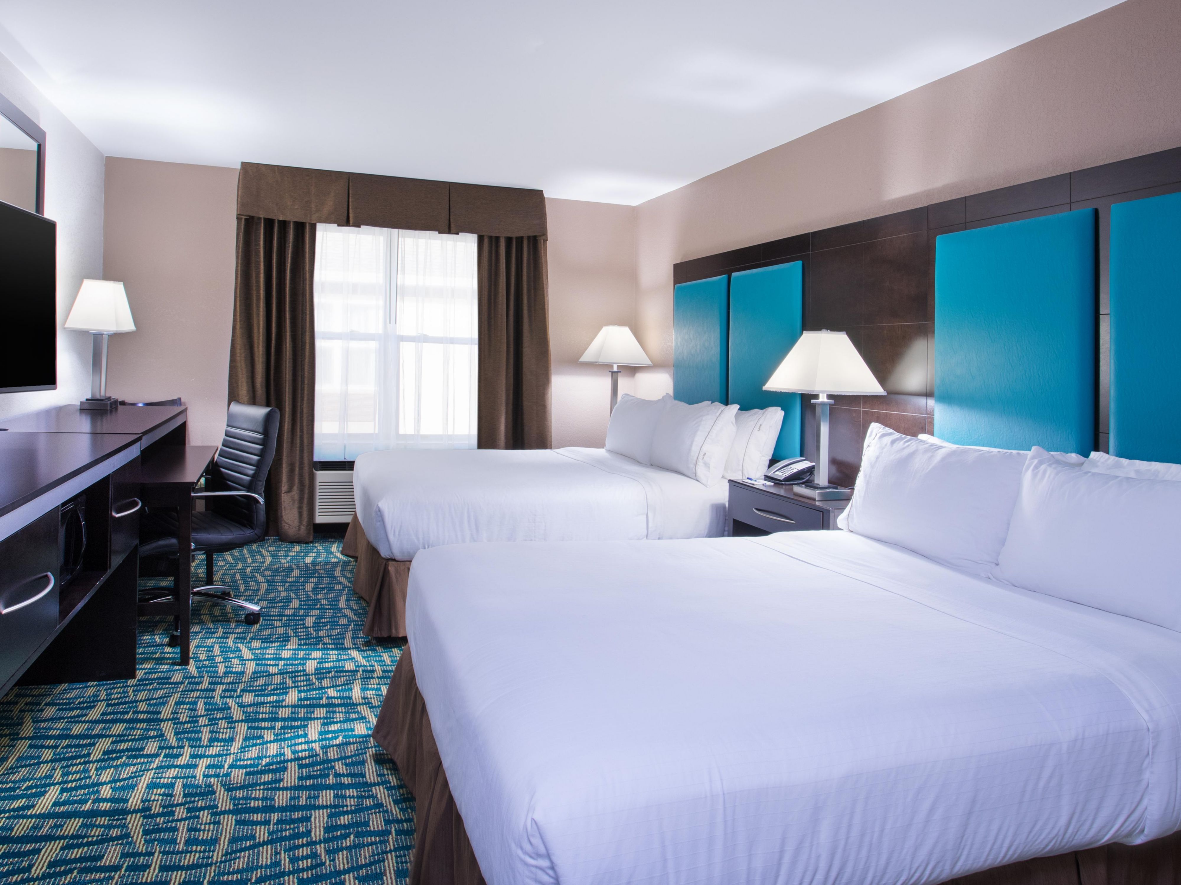 OUR TWO QUEEN BEDROOM OFFERS GUESTS USE OF FREE WI-FI