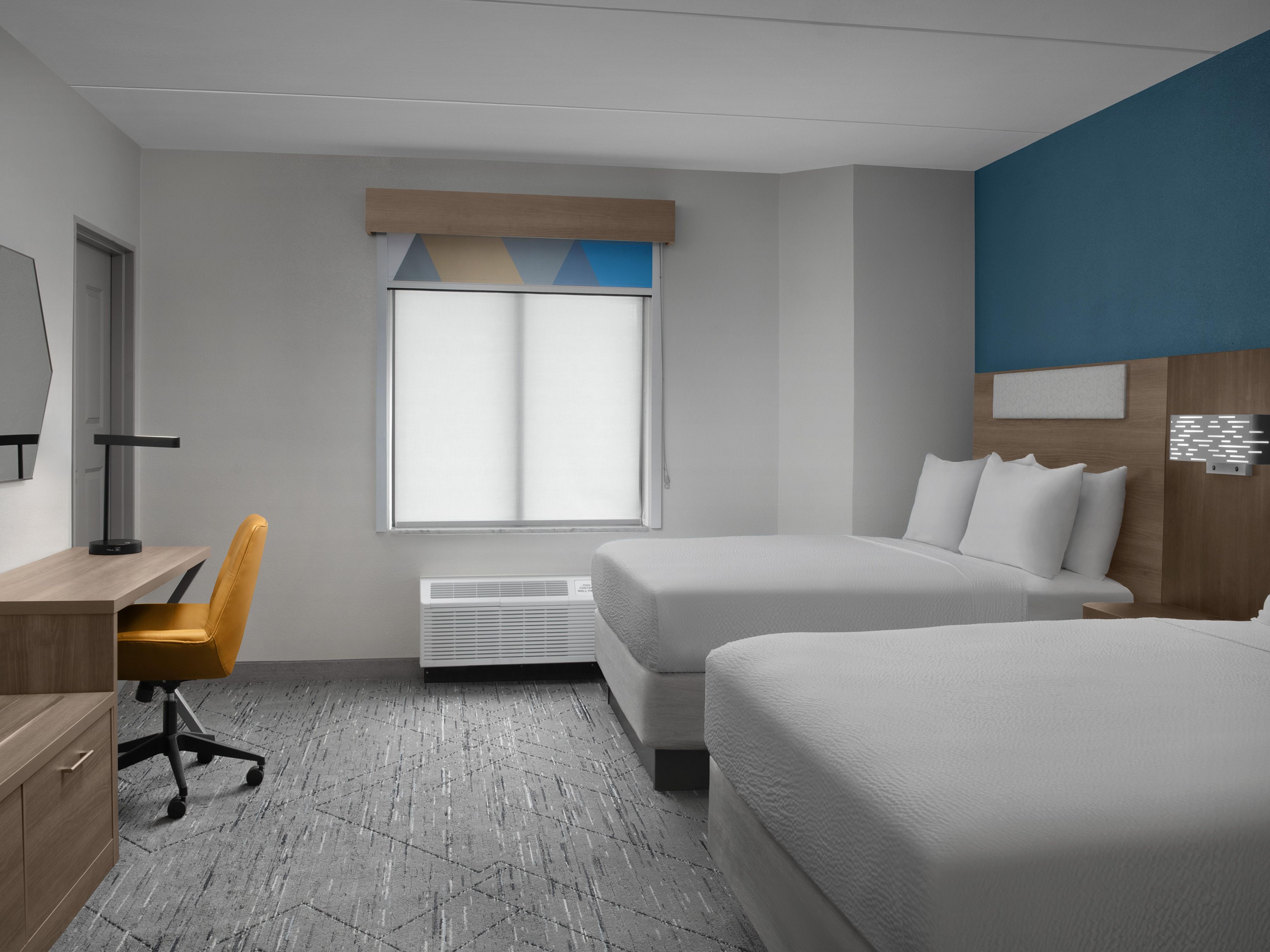 Relax and unwind in our modern 2 Queen guest room.