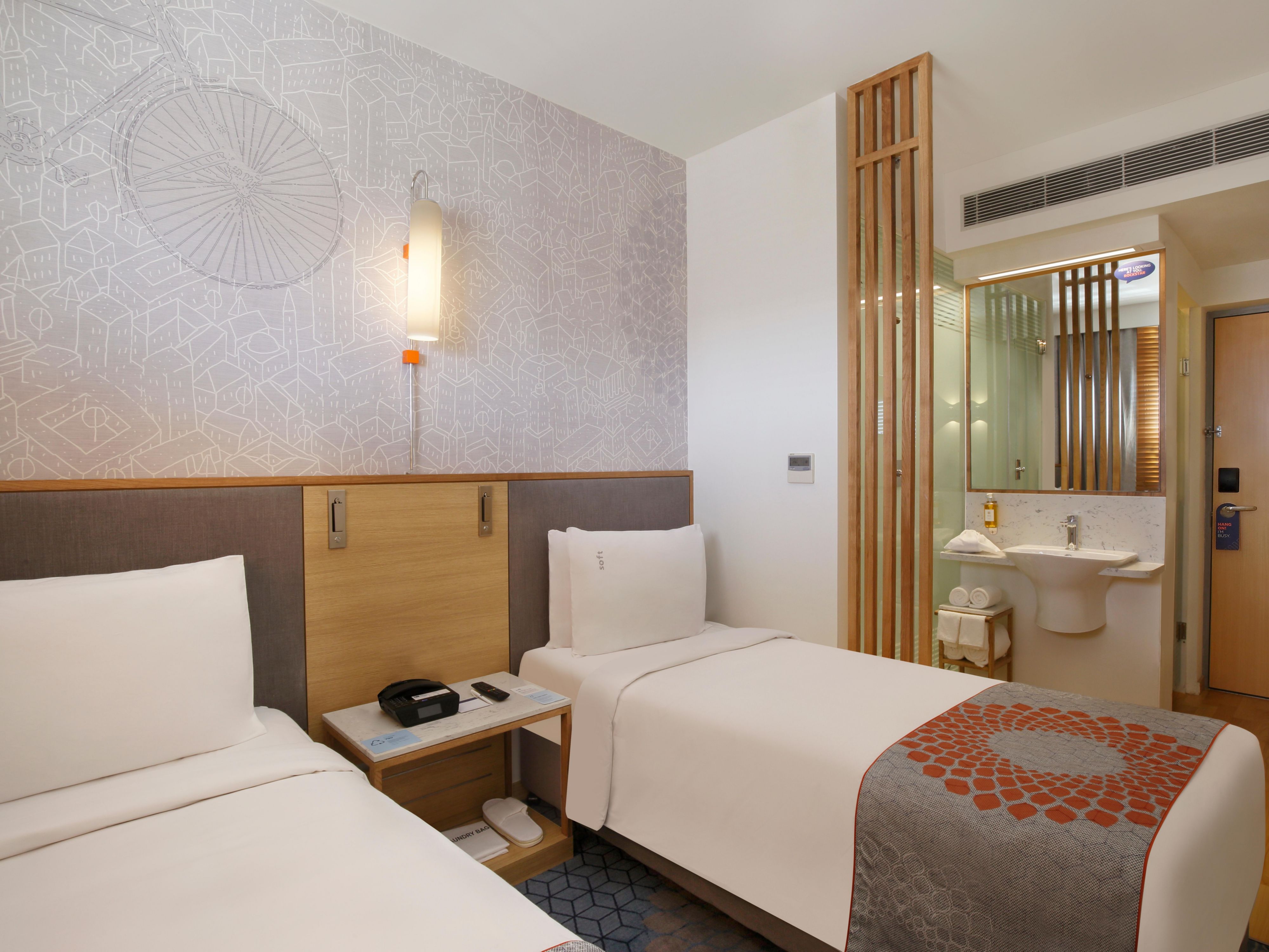 “Experience the coziness of our guestrooms featuring space-efficient design and convenient amenities such as a complimentary breakfast, Wi-Fi, and multi-purpose charging cables for your devices.