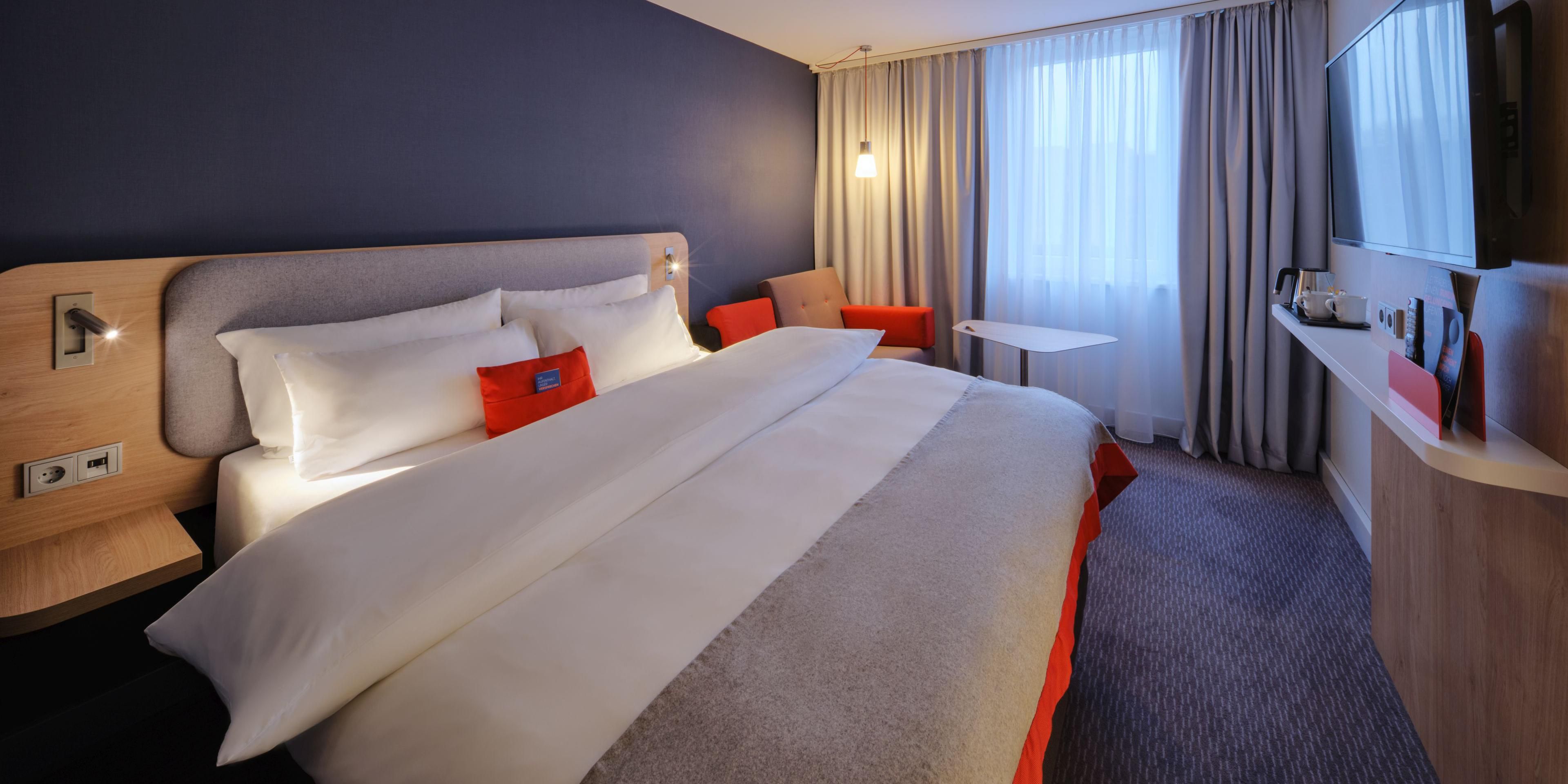 Drift off to sleep in our restful Next Generation guest rooms with blackout curtains and comfortable beds. They're decorated in calm shades enlivened by pops of colour and all have Flatscreen TVs, bedside USB ports and inclusive Wi-Fi. If you're travelling with kids, all our family rooms have sofa beds.