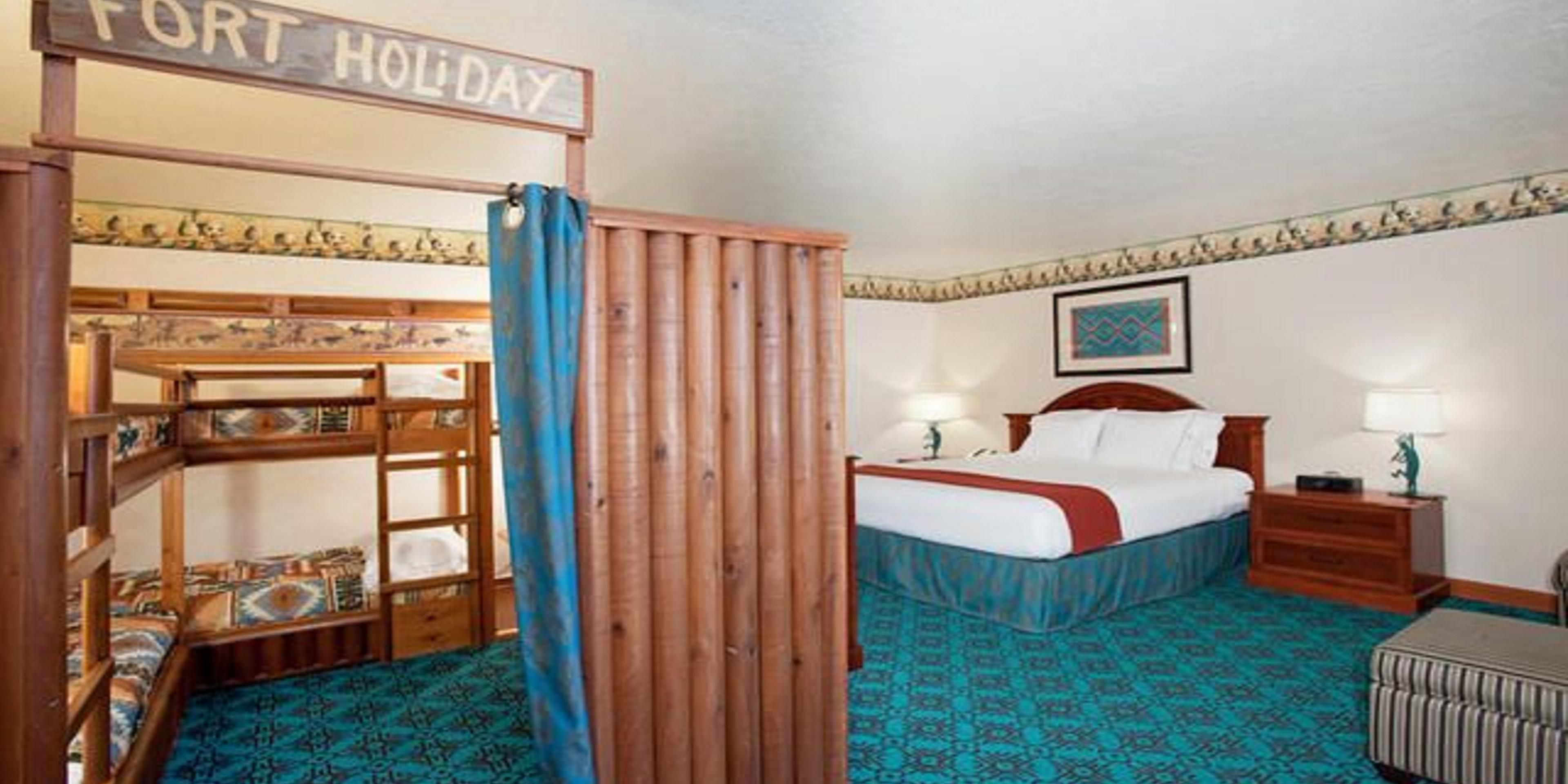 Our King Kids Suite is fun and comfortable for all. Relax while the kids play, modeled after an old west fort, there is two sets of junior bunk beds and a Play Station 3 included for the kids entertainment. 