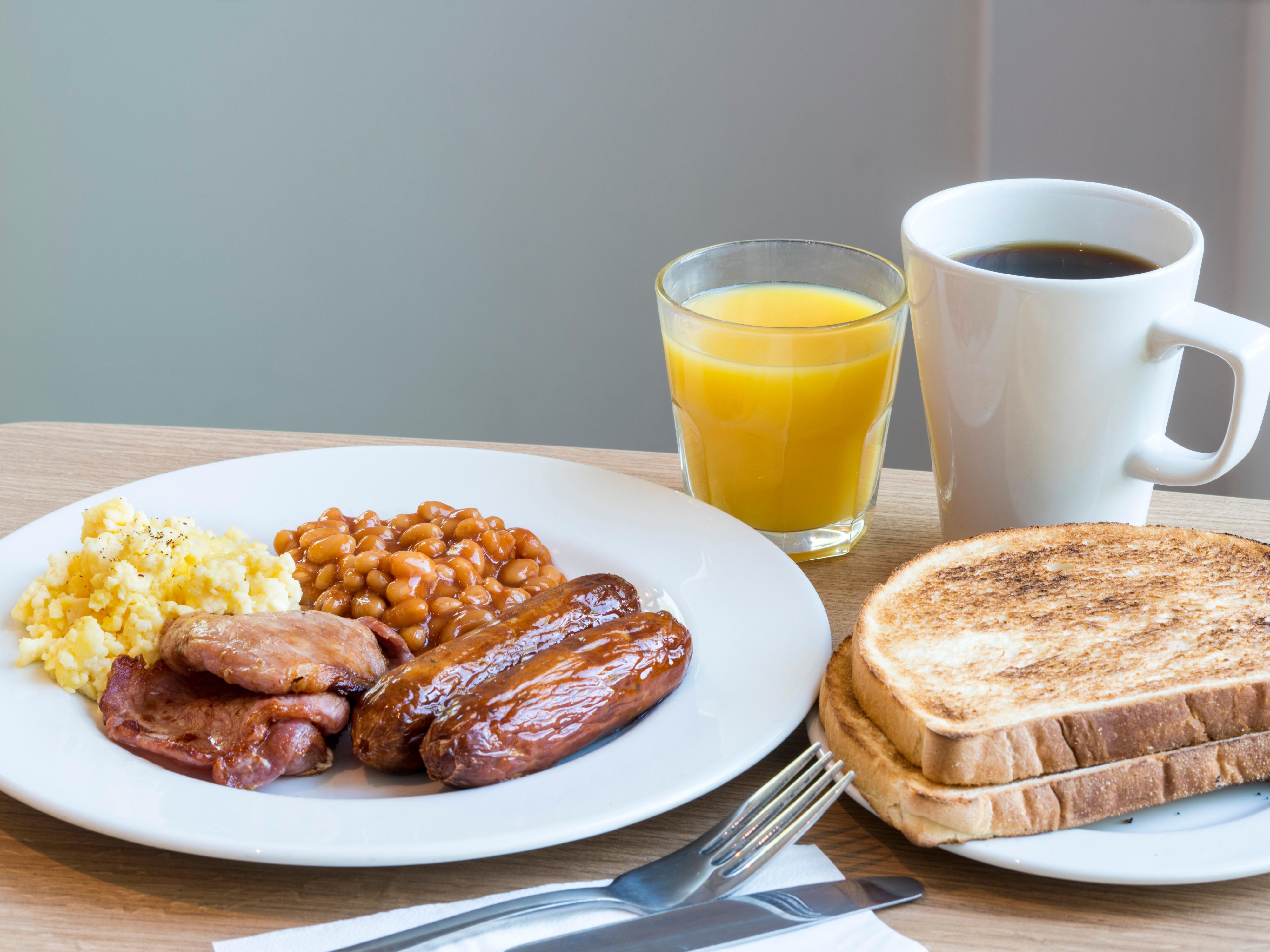 Our Free Breakfast includes scrambled egg, bacon, sausage, cooked tomatoes, beans, hash browns along with cereals, yoghurt, croissants, toast and fruit.