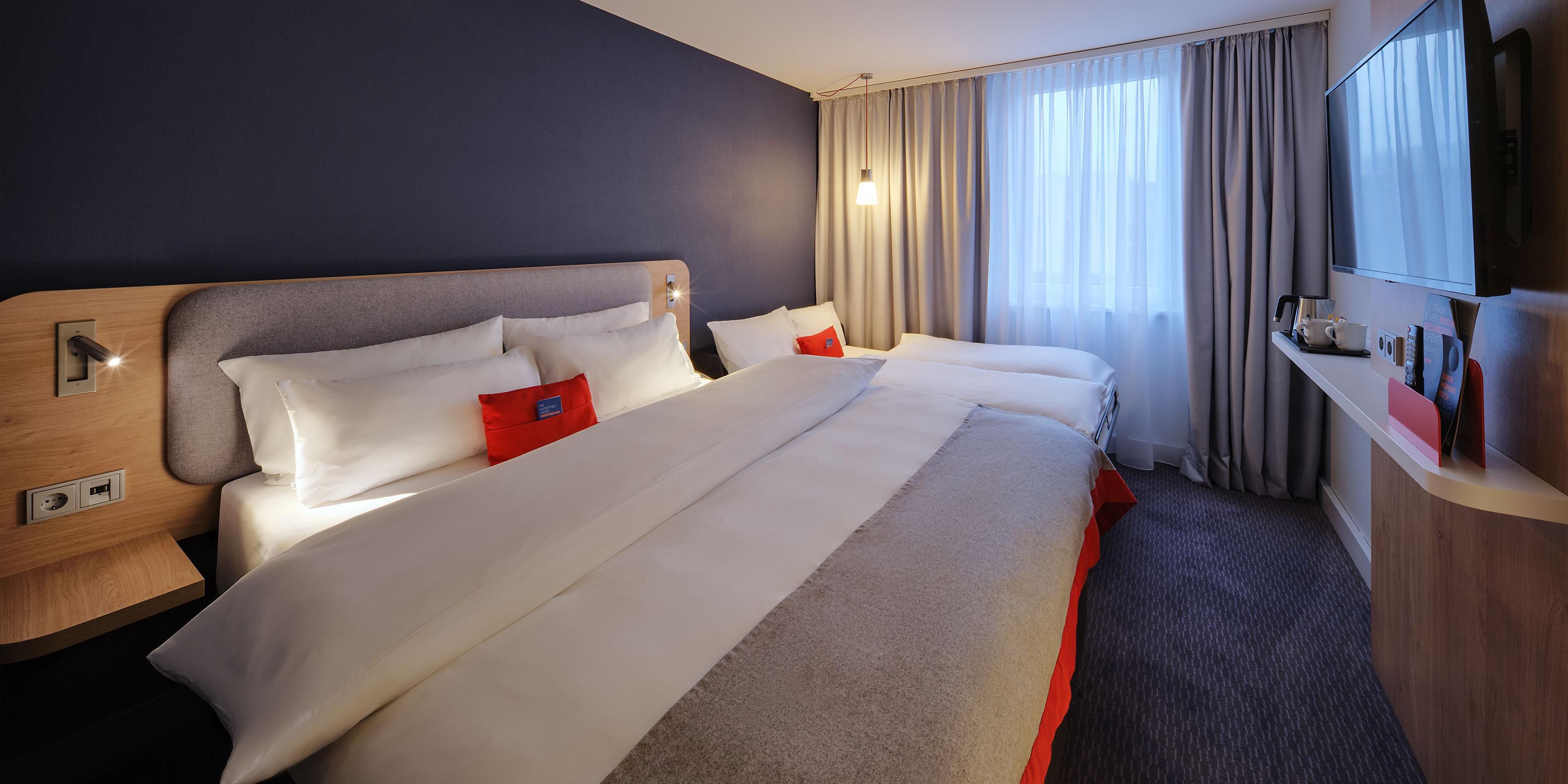 Drift off to sleep in our restful next-generation guest rooms with blackout curtains and comfortable beds. They're decorated in calm shades enlivened by pops of colour and all have Flatscreen TVs, bedside USB ports, and inclusive WiFi. If you're travelling with kids, all our family rooms have sofa beds.