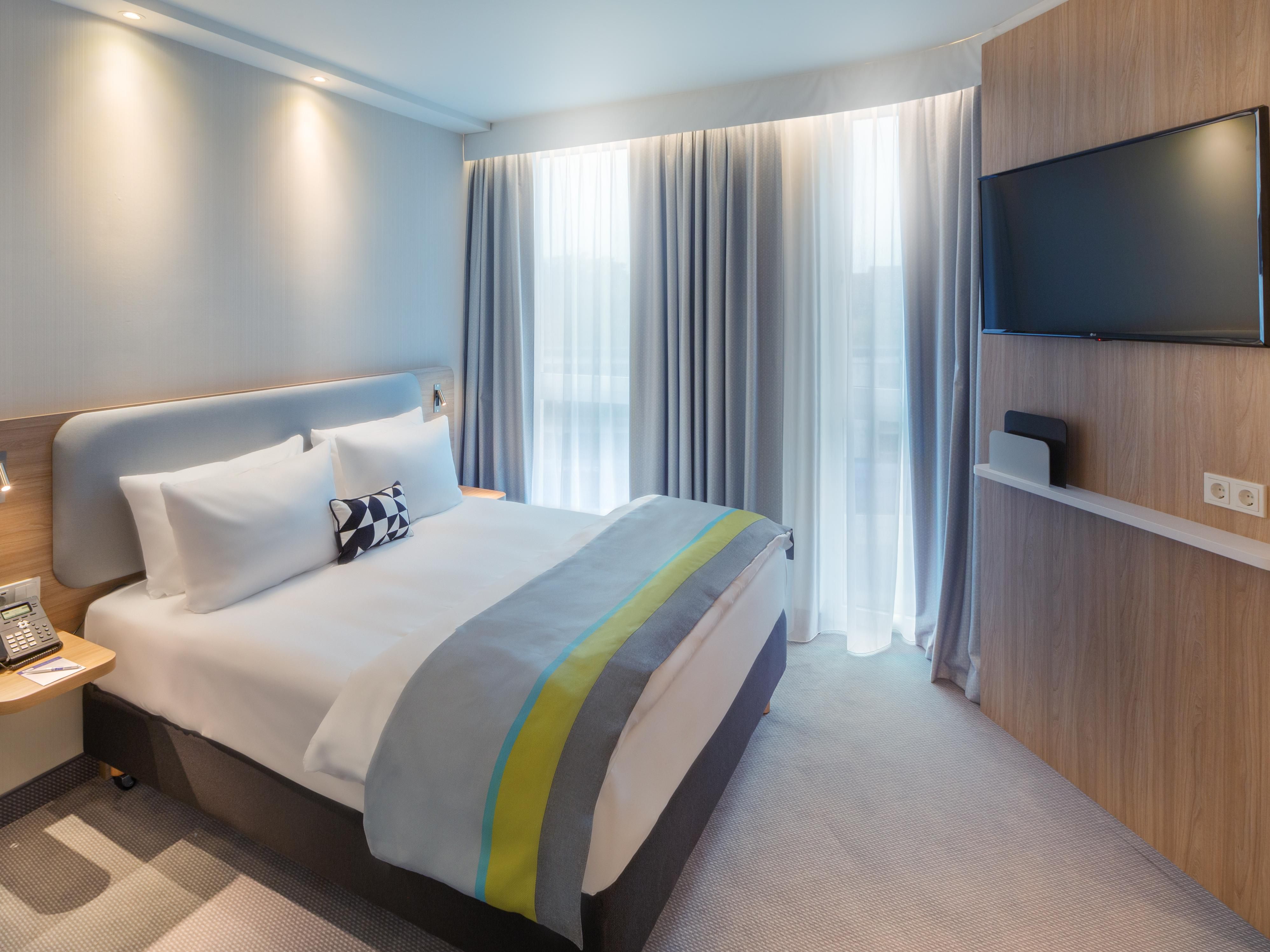 Recently updated, our Erlangen hotel is designed to help business travellers thrive and leisure guests unwind. Each room features a dedicated workspace with USB for increased productivity, plus amenities like HDTV and fast, free Wi-Fi. Clean, modern, and comfortable—we make every stay seamless from workday to getaway.