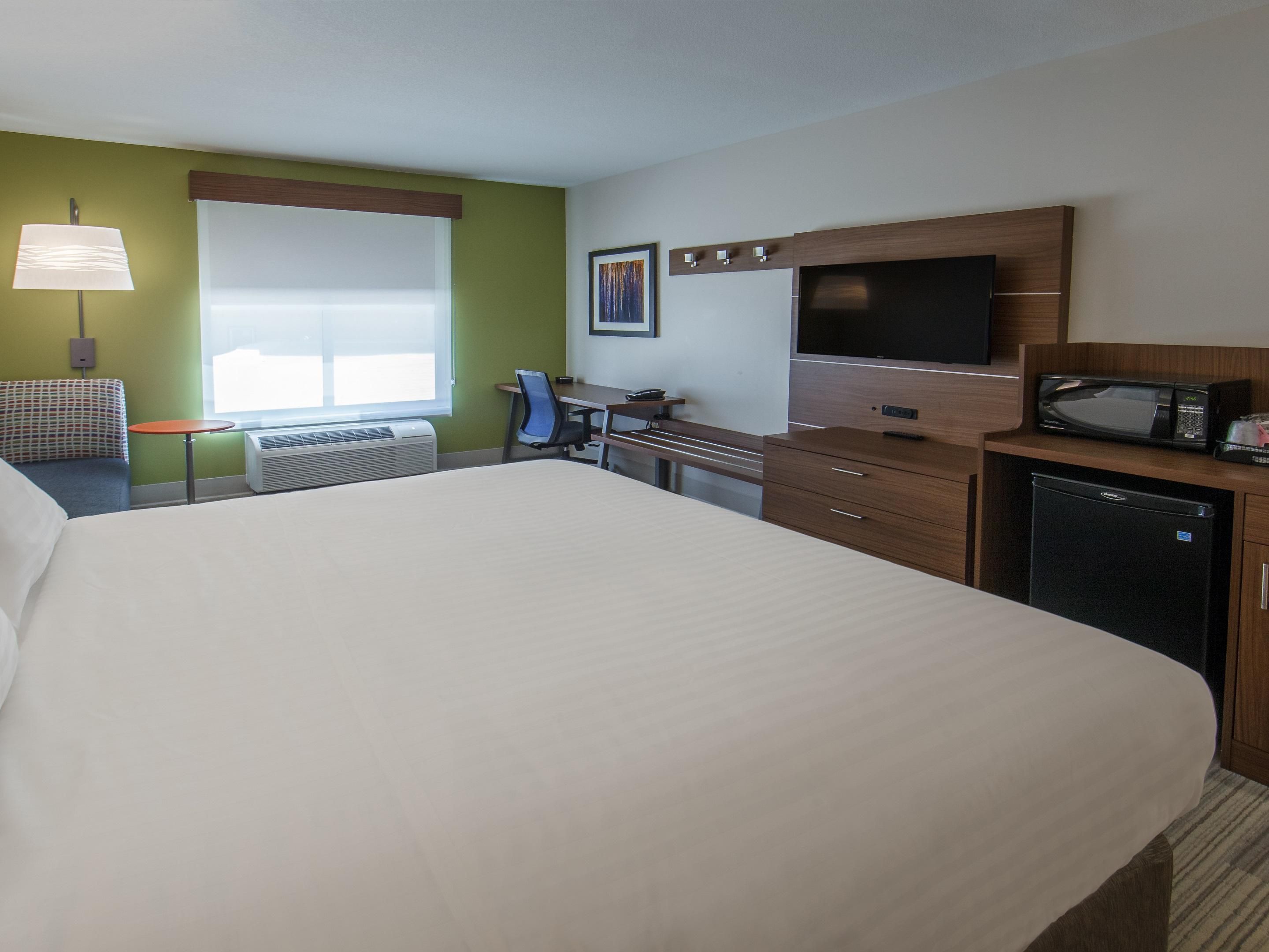 Standard rooms offer a king-size bed, mini fridge, and microwave
