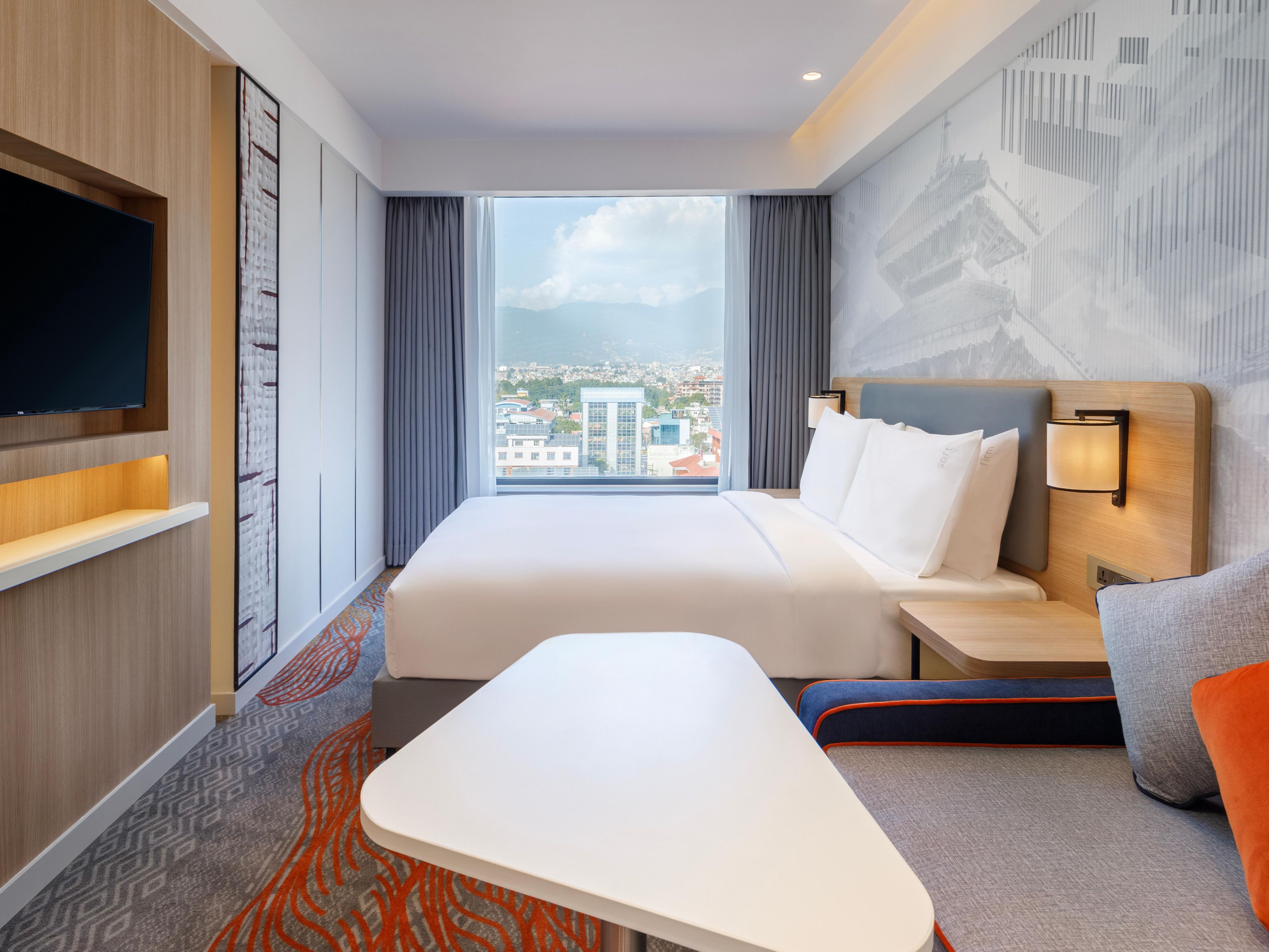 Cherish your stay in one of our 100 rooms, where interiors blend contemporary minimalism with vibrant energy. There is one exclusive suite as well. In all rooms, amenities like free Wi-Fi, a mini-bar, a safe, tea & coffee maker, daily housekeeping, and more, make our hotel in KTM not just a stay, but a comfy getaway.