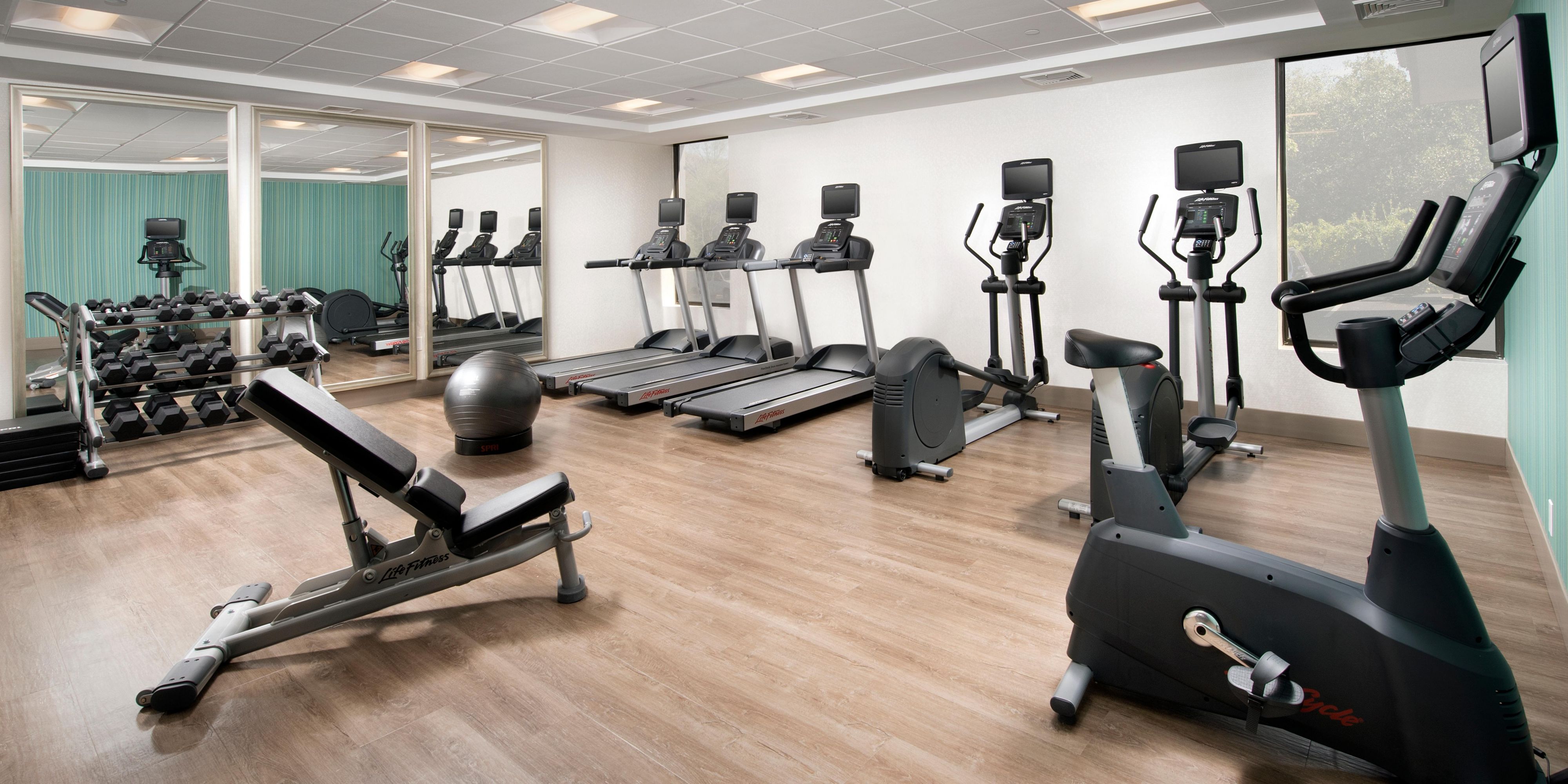 On site fitness center opened 24 hours a day. All the equipment you need including treadmills, bicycle, and elliptical. TVs located on the  stationary machines. 