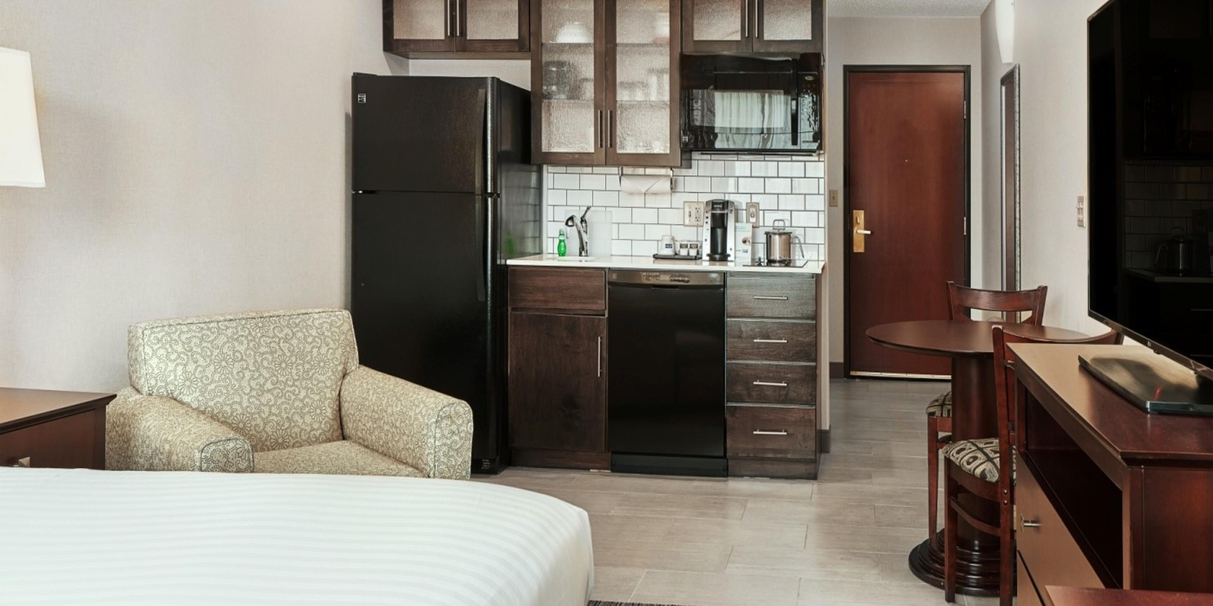 Unique King suites with full kitchens available. If you need to stay long term, we have a sweet suite for you! Suites include full size refrigerator, cook top, dishwasher, garbage disposal, real plates silverware and cookware, etc. This combined with free hot breakfast, indoor pool/hot tub, and daily housekeeping make for the perfect extended stay.