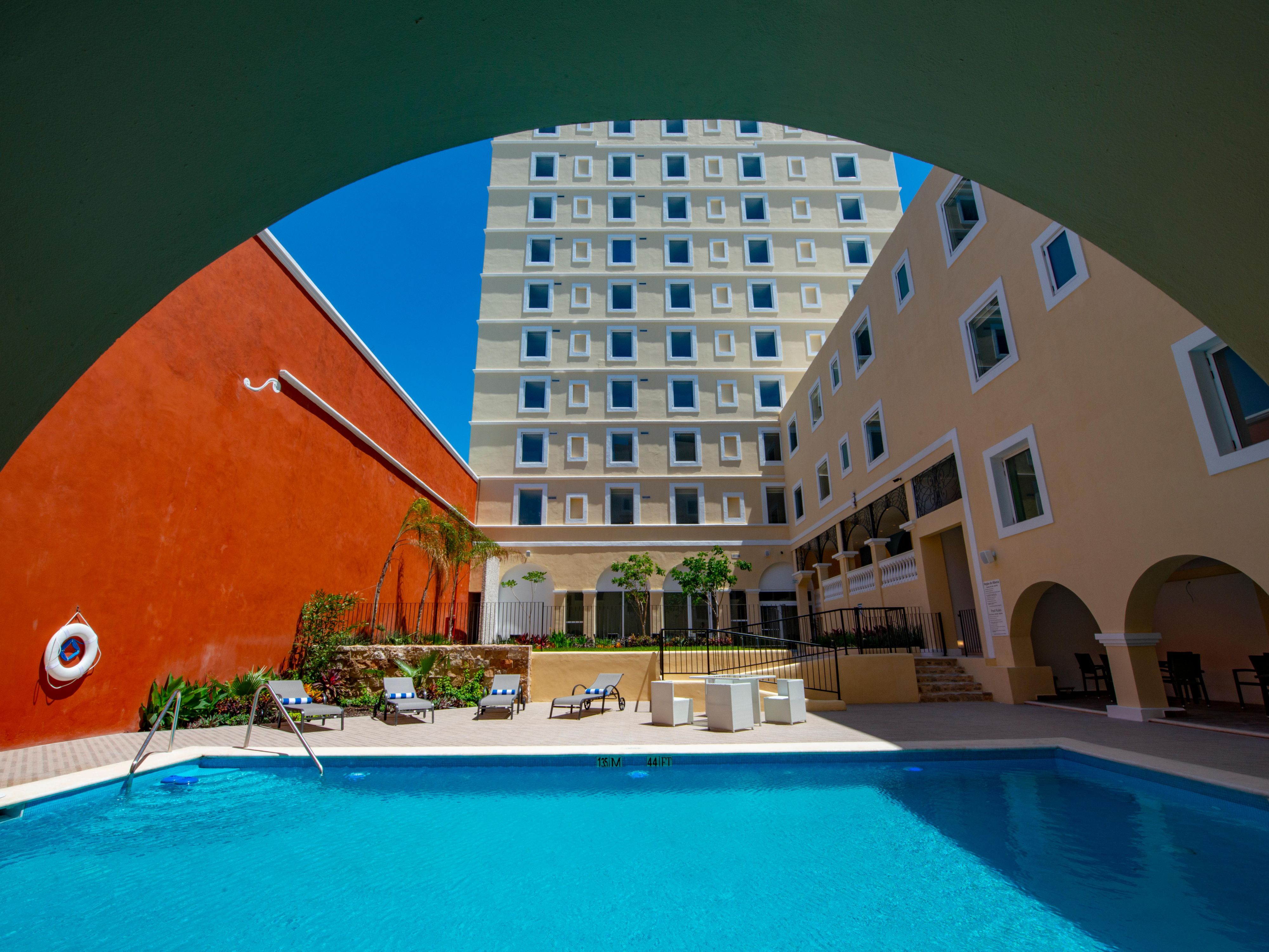 Discover one of our hotels in Merida, Mexico, where contemporary elegance meets local warmth. Relax under the sun by the outdoor pool, complete with terrace and loungers, stay active in our fully equipped gym, or work uninterrupted in our 24/7 business center. Parking is available for an additional fee.