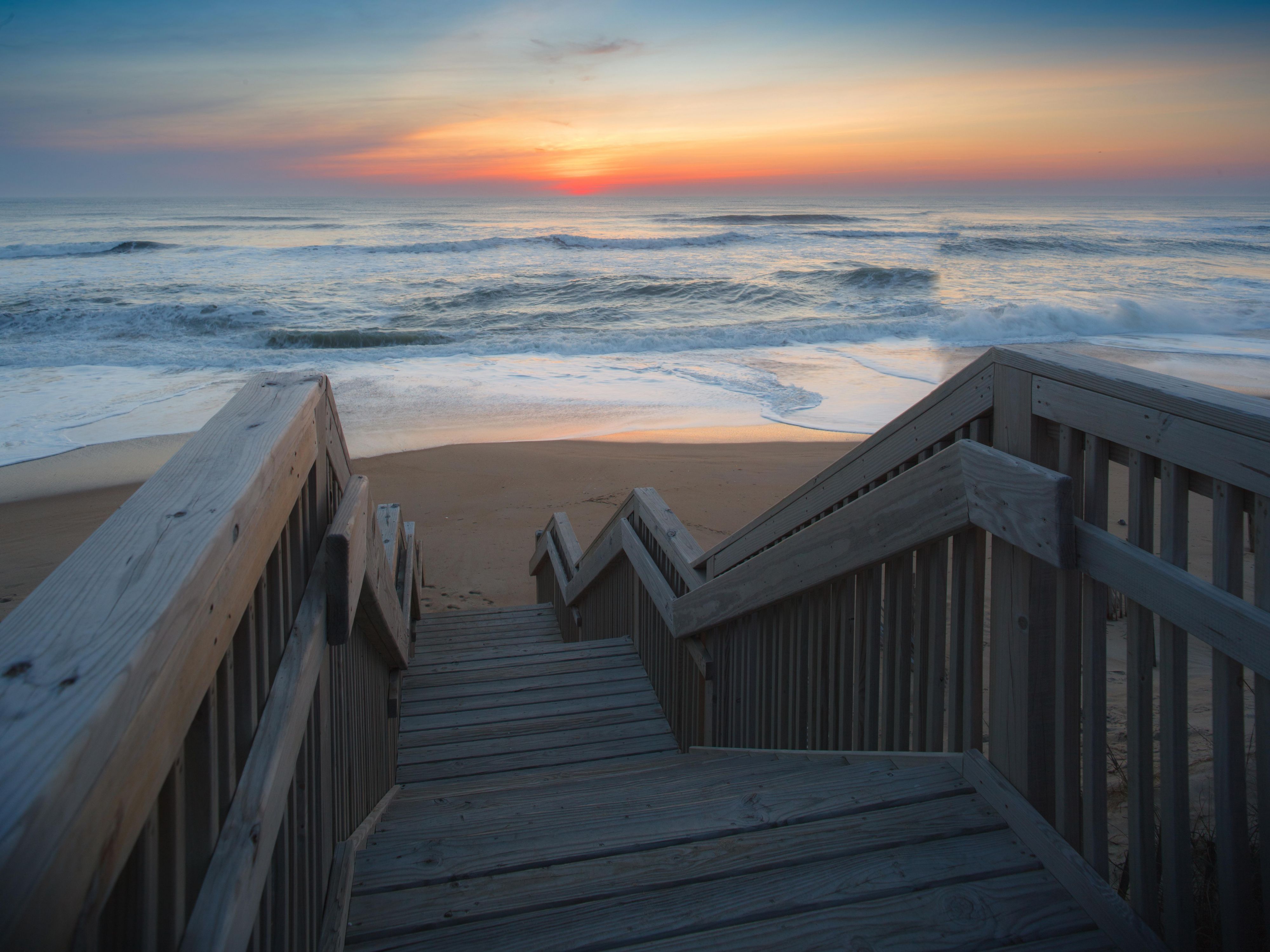 Experience the ultimate beachfront getaway at our oceanfront hotel, where you can step right onto the sands of the Atlantic Coast from your room. Enjoy private beach access, breathtaking ocean views, and the serenity of Nags Head, NC.