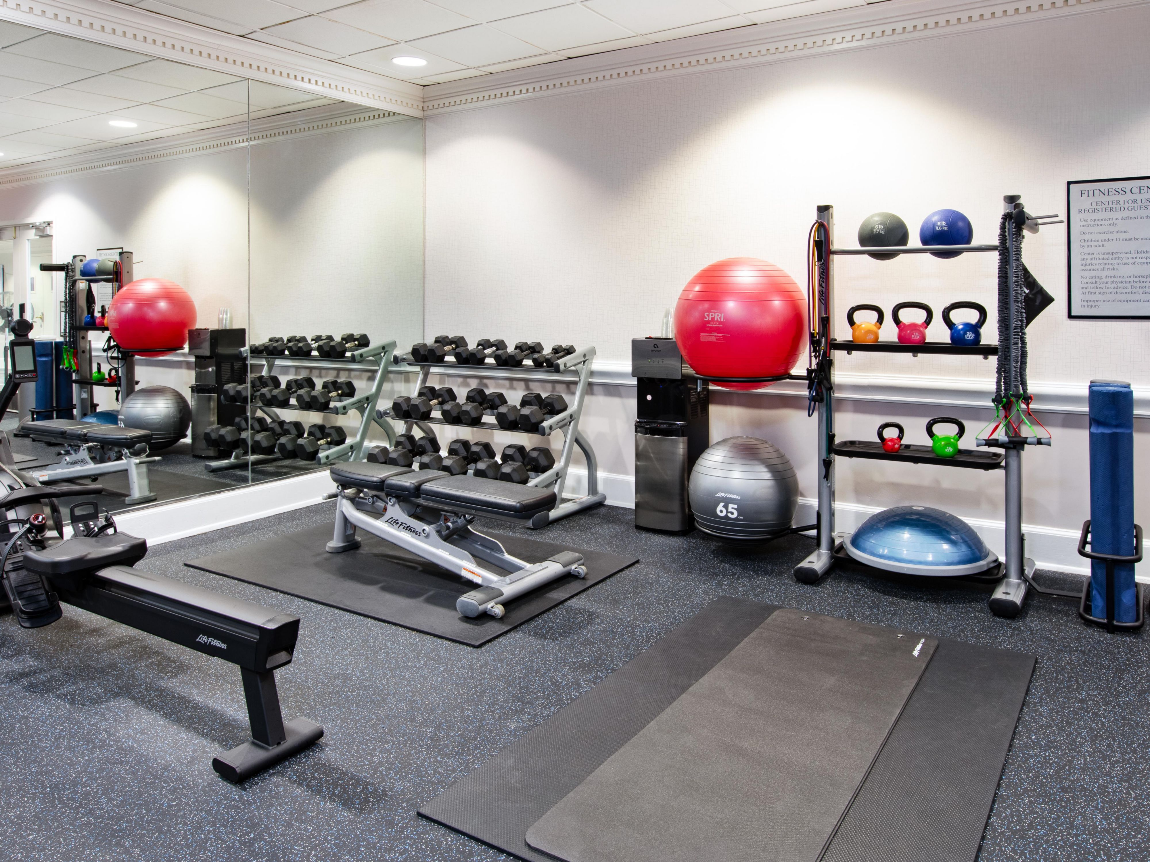 Fitness center with a variety of cardio and free weight options.