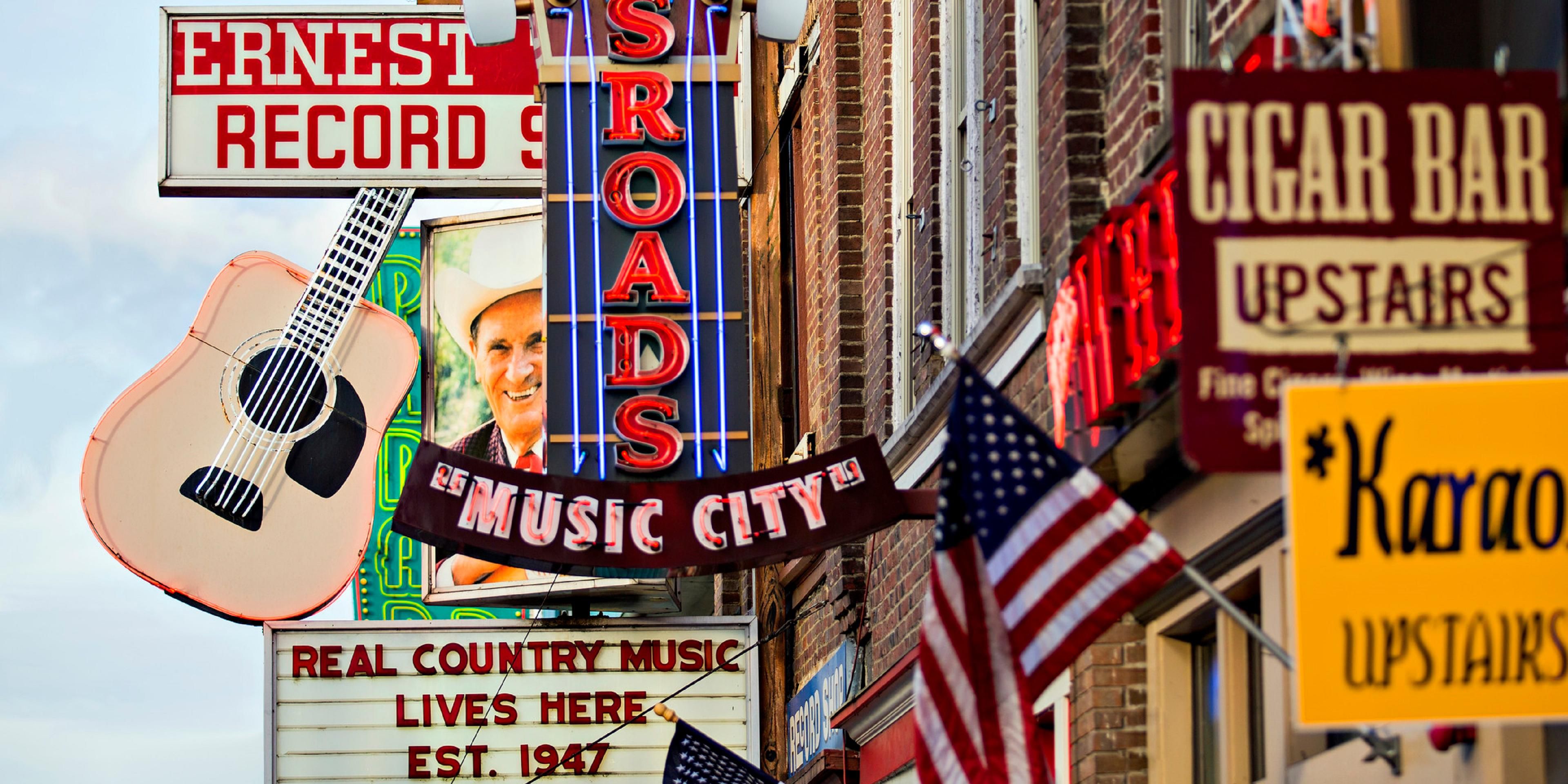 Bar, venue and restaurant signs on street in Downtown Nashville.