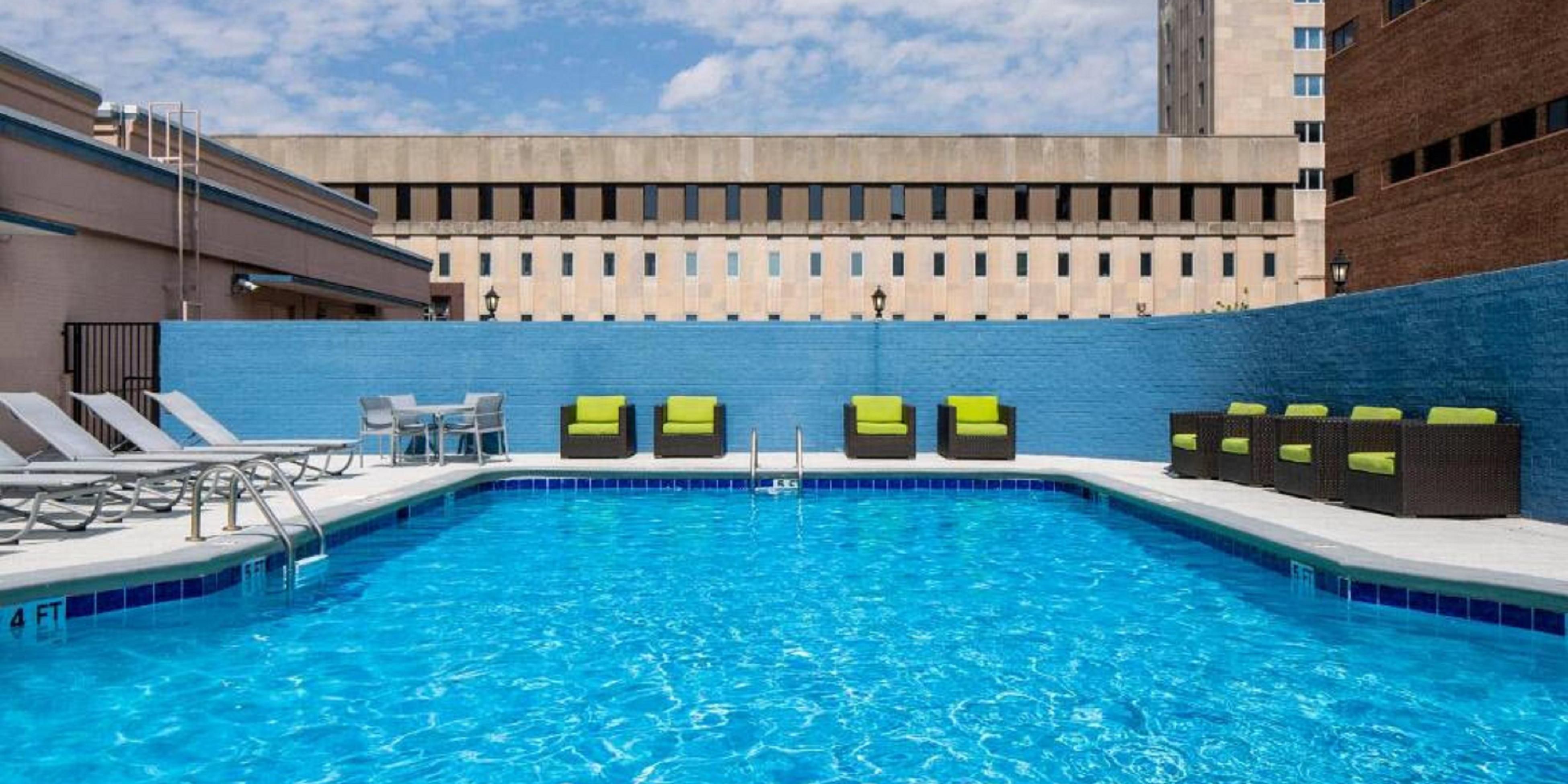 Inviting outdoor pool with lounge chairs.