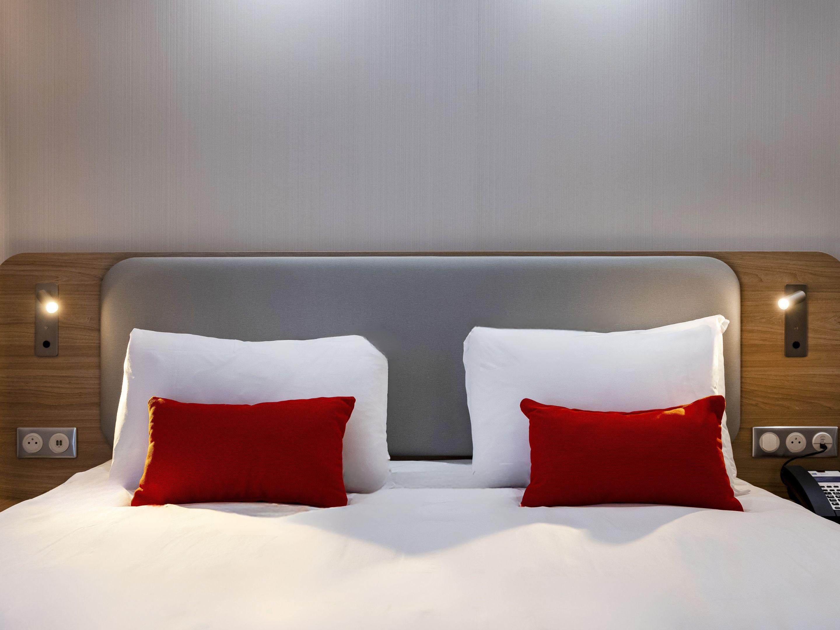 The hotel's comfortable bedding ensures a peaceful night's sleep.