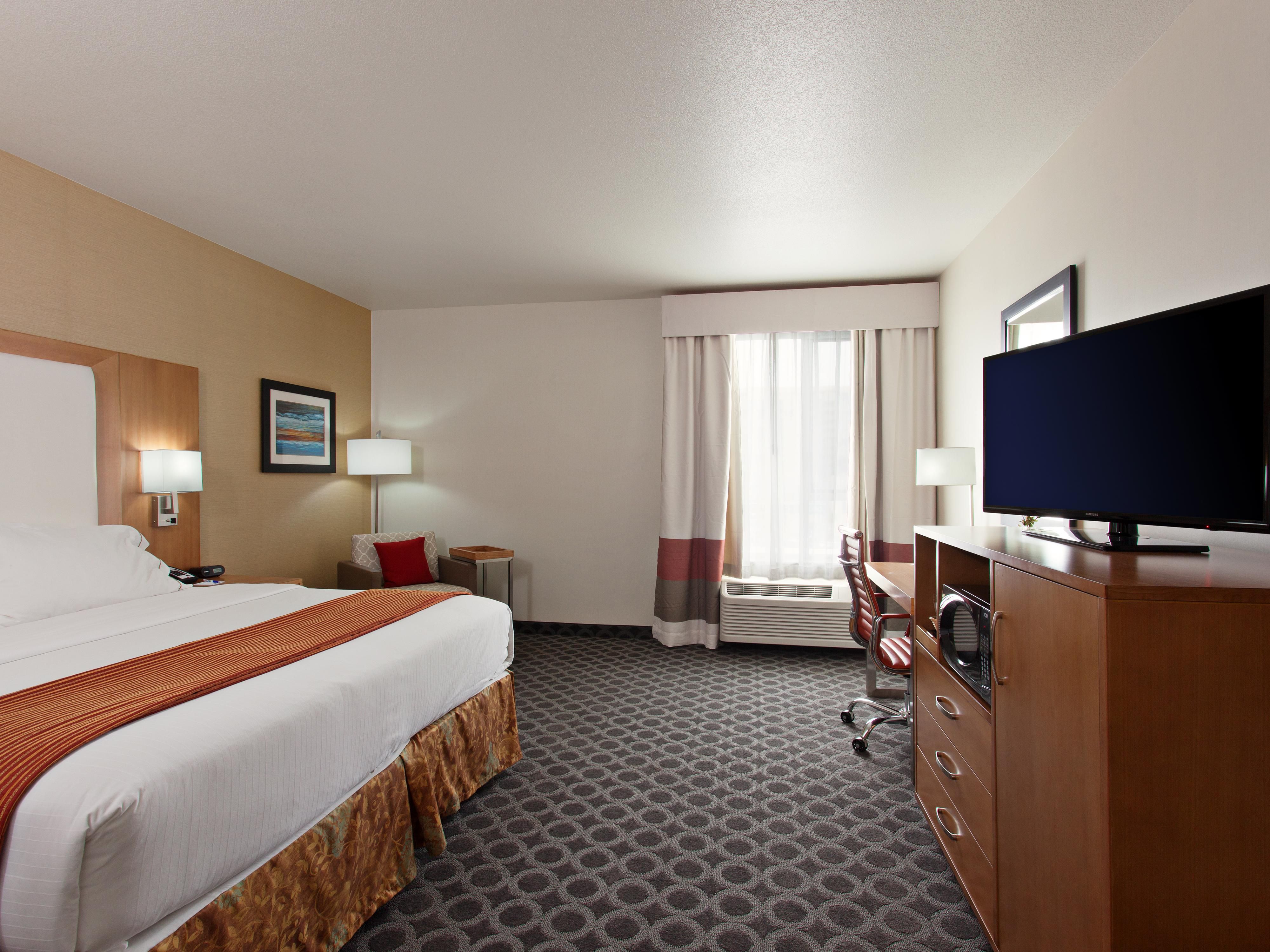 All Guest Rooms feature a modern design for maximum comfort including soft LED Lighting, Premium Bedding and Furnishings, 42 inch Flat Screen, Large Work Desk, Mini Refrigerator, Safe Box, Keurig Coffee Maker, Iron and Ironing Board, Double Paned Windows and Comfortable Sitting Chair with Ottoman.