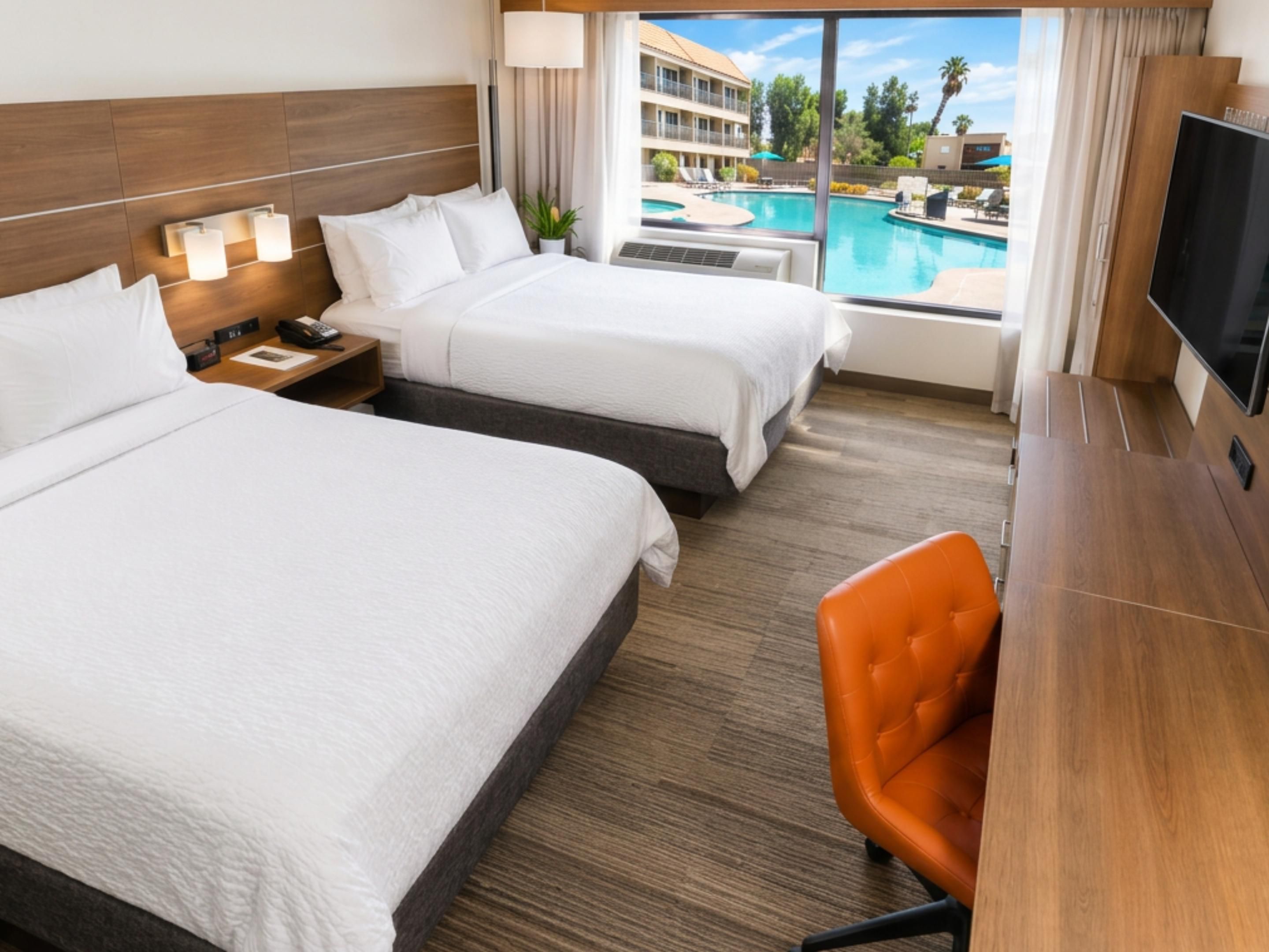 Standard Double Queen Room- Smart design and cozy comfort.
