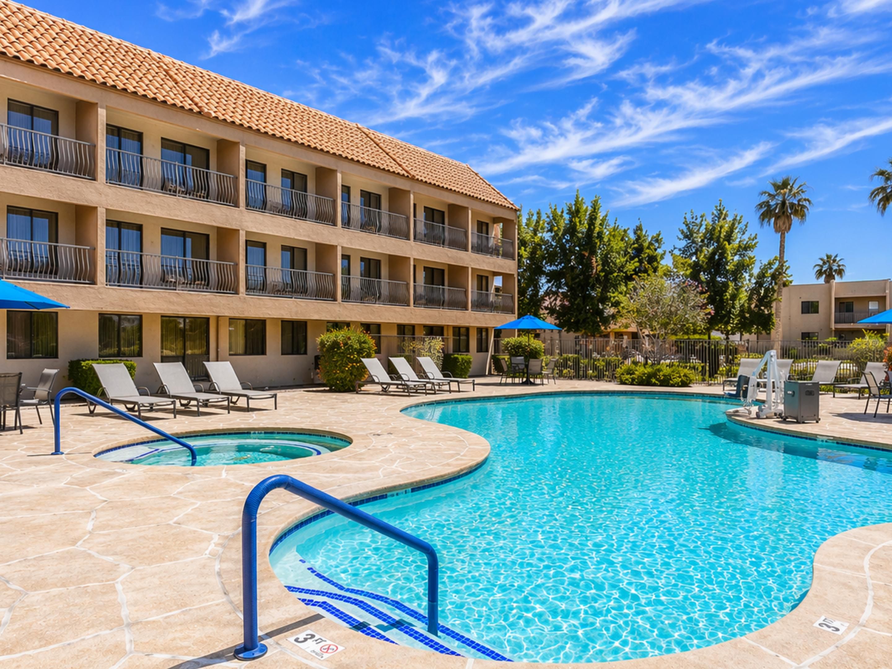Relax and recharge at our sunny outdoor pool in Palm Desert, CA.