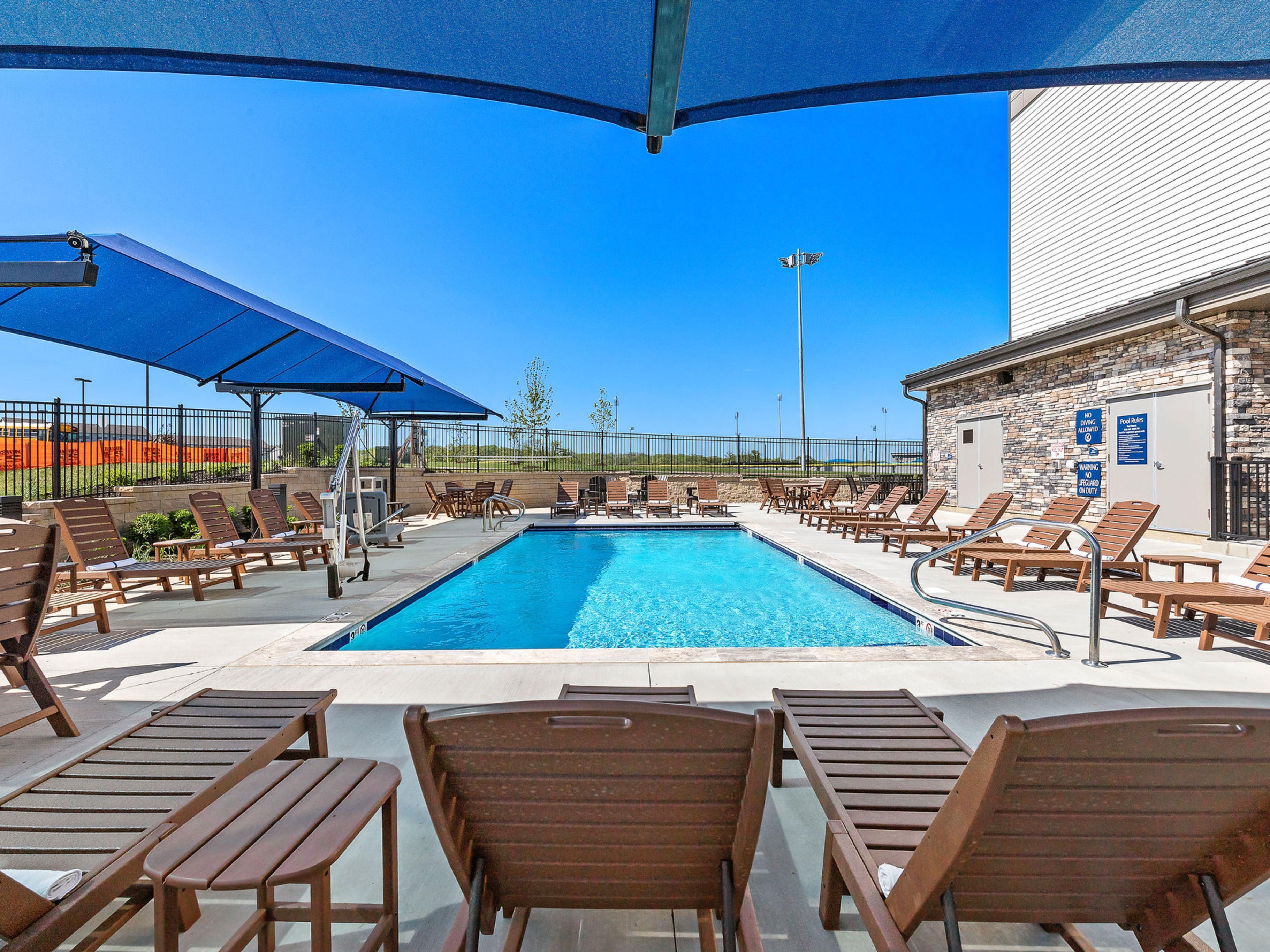 Our hotel near MCI Kansas City offers all the amenities you need. Start your day with a free Express Start® Breakfast, stay active in our 24-hour Fitness Center, and unwind by the fire pit on our patio or at the seasonal outdoor pool. Enjoy free parking, EZ Charging Stations, Wi-Fi, and pet-friendly accommodations for a seamless stay.