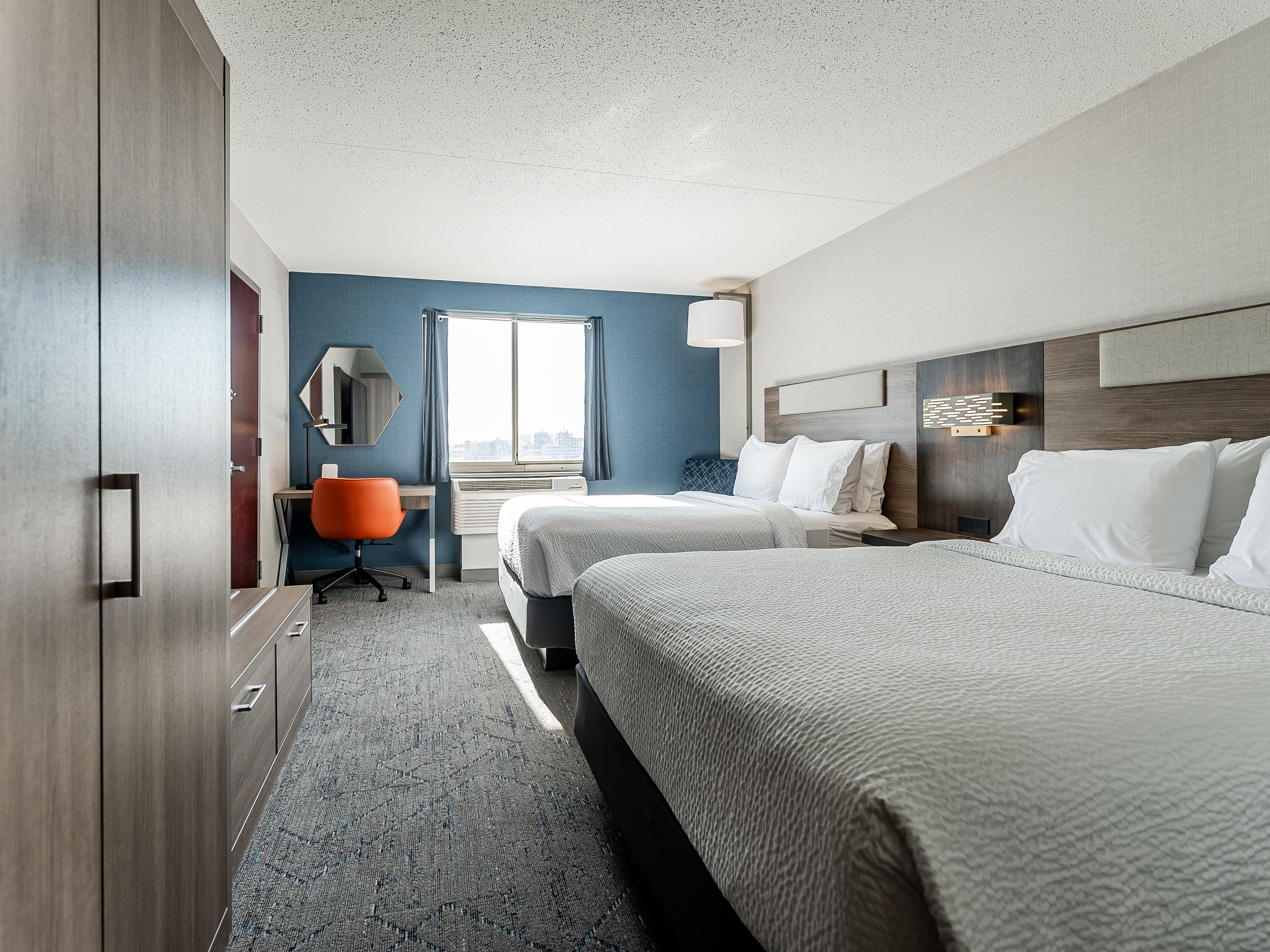 Relax in this spacious room with 2 Queen Beds and work space