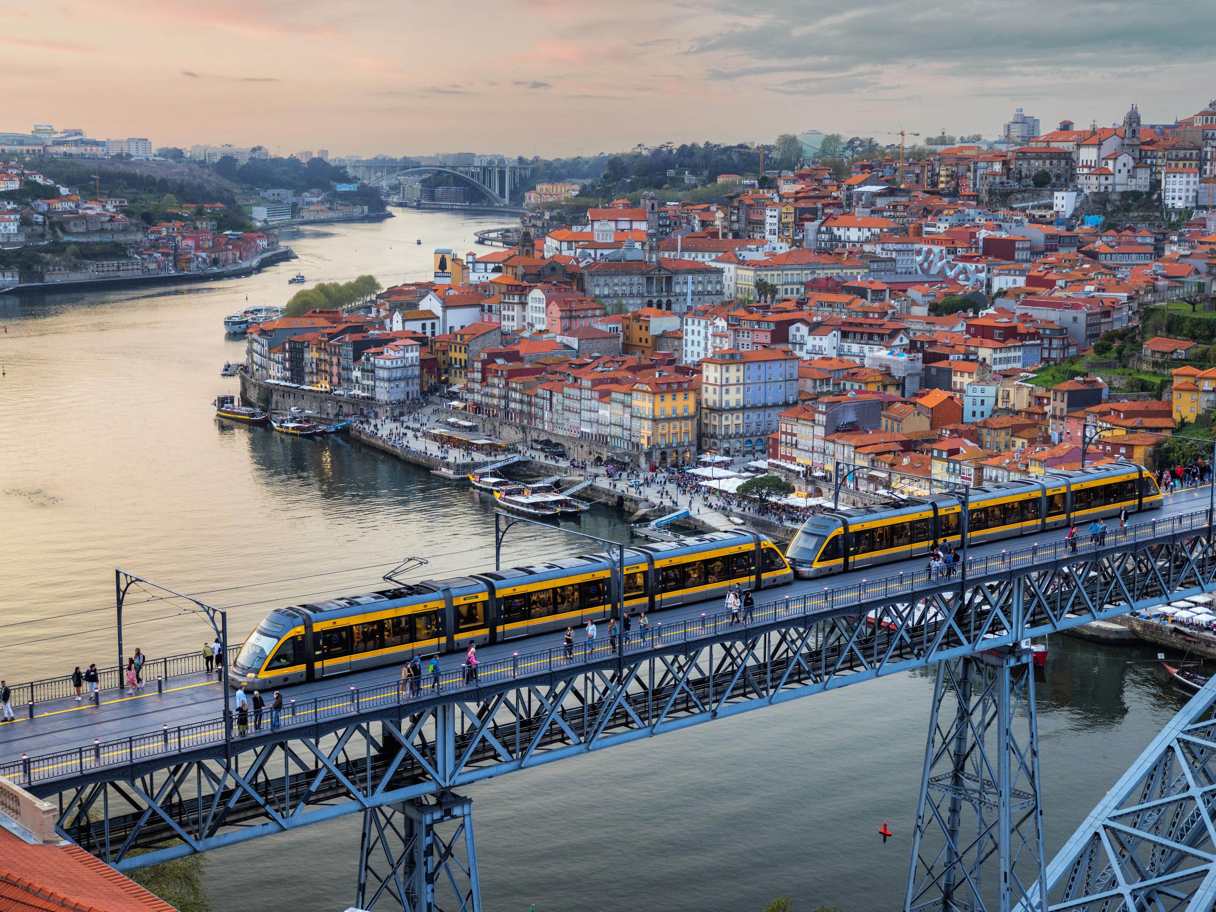 Discover Porto’s Ribeira, the colorful, UNESCO-listed Old Town. Wander narrow cobblestone streets, admire terraced medieval houses with vibrant façades, and enjoy cafés along the Douro waterfront. From historic Praça da Ribeira to the Dom Luís I Bridge, every corner brims with authentic charm, riverside views, and local life.