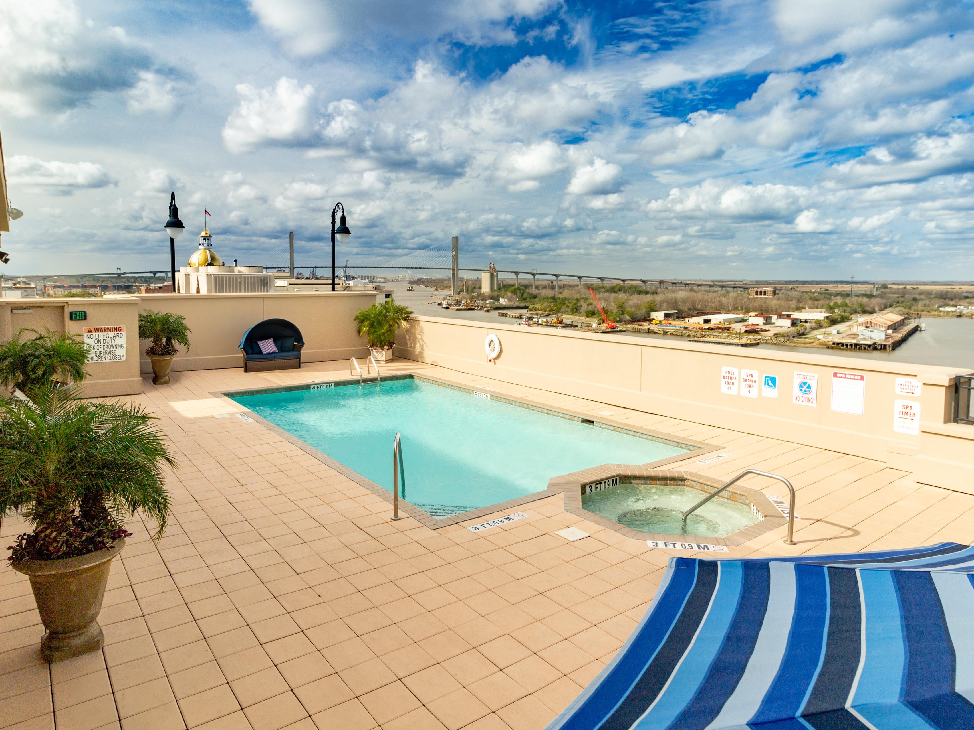 Outdoor pool with views of City Hall and Savannah River