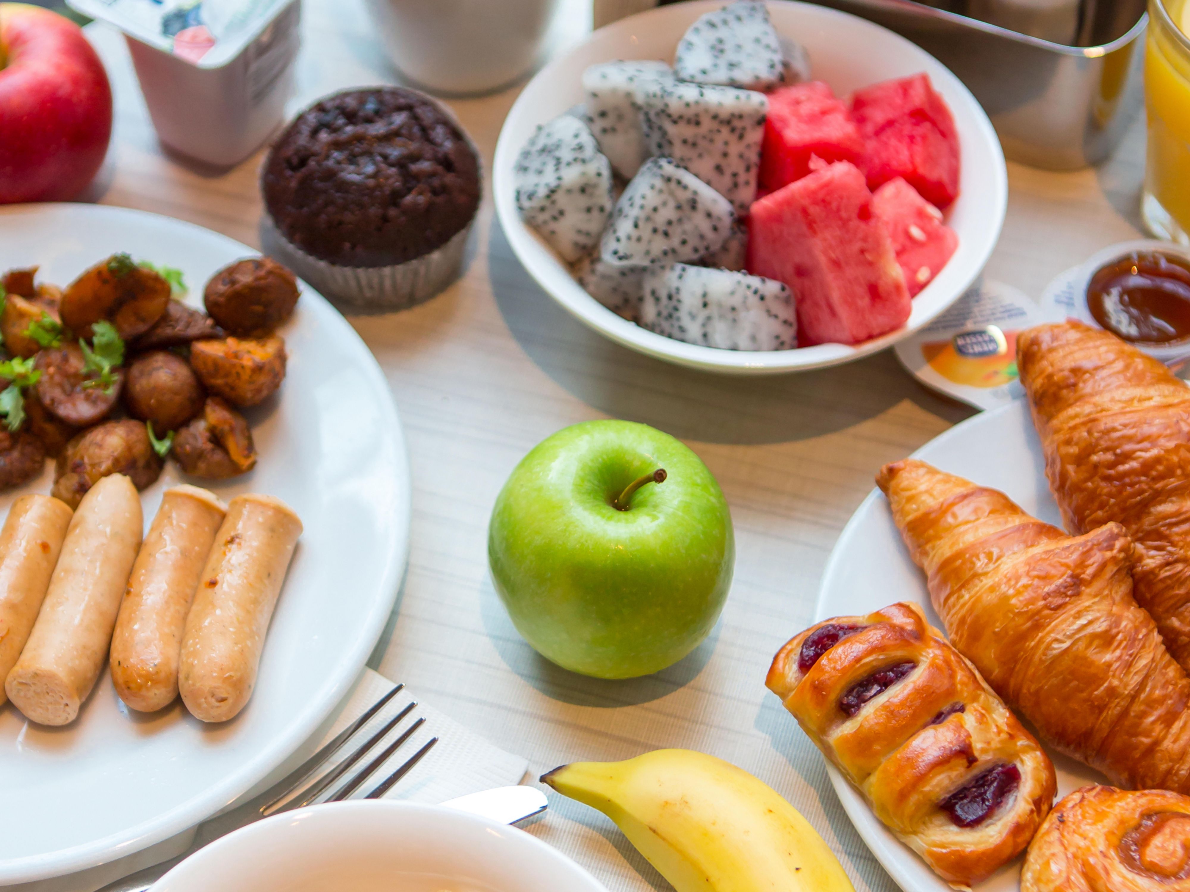Image 144: Start your day with our free breakfast buffet (Halal-certified). Served in the Great Room, this morning feast of Asian and Western flavours promises delectable delights for every palate and the assurance of meeting diverse dietary needs. We also provide a grab & go option for those in a hurry.