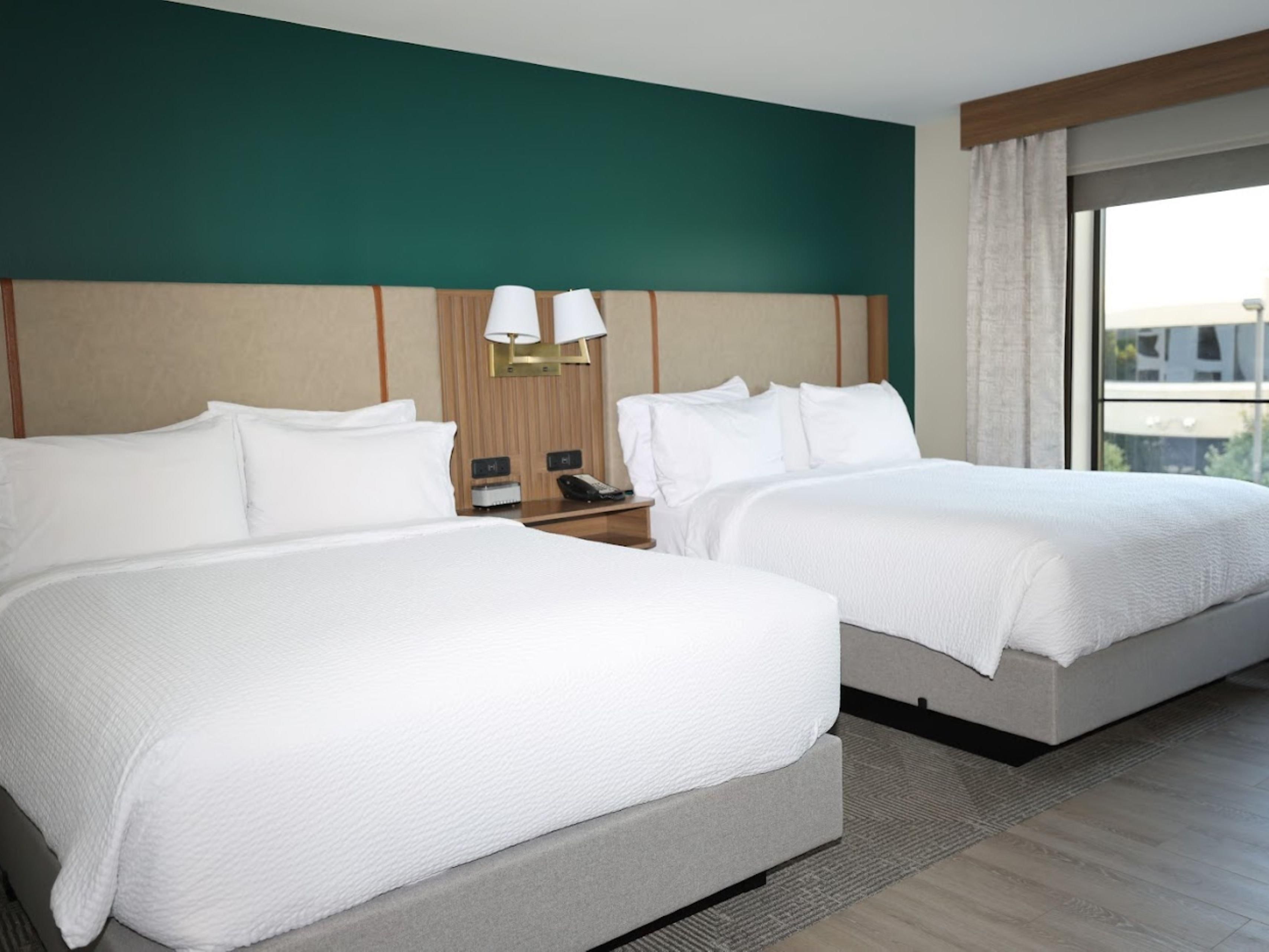Stylish guestroom with two comfortable queen beds