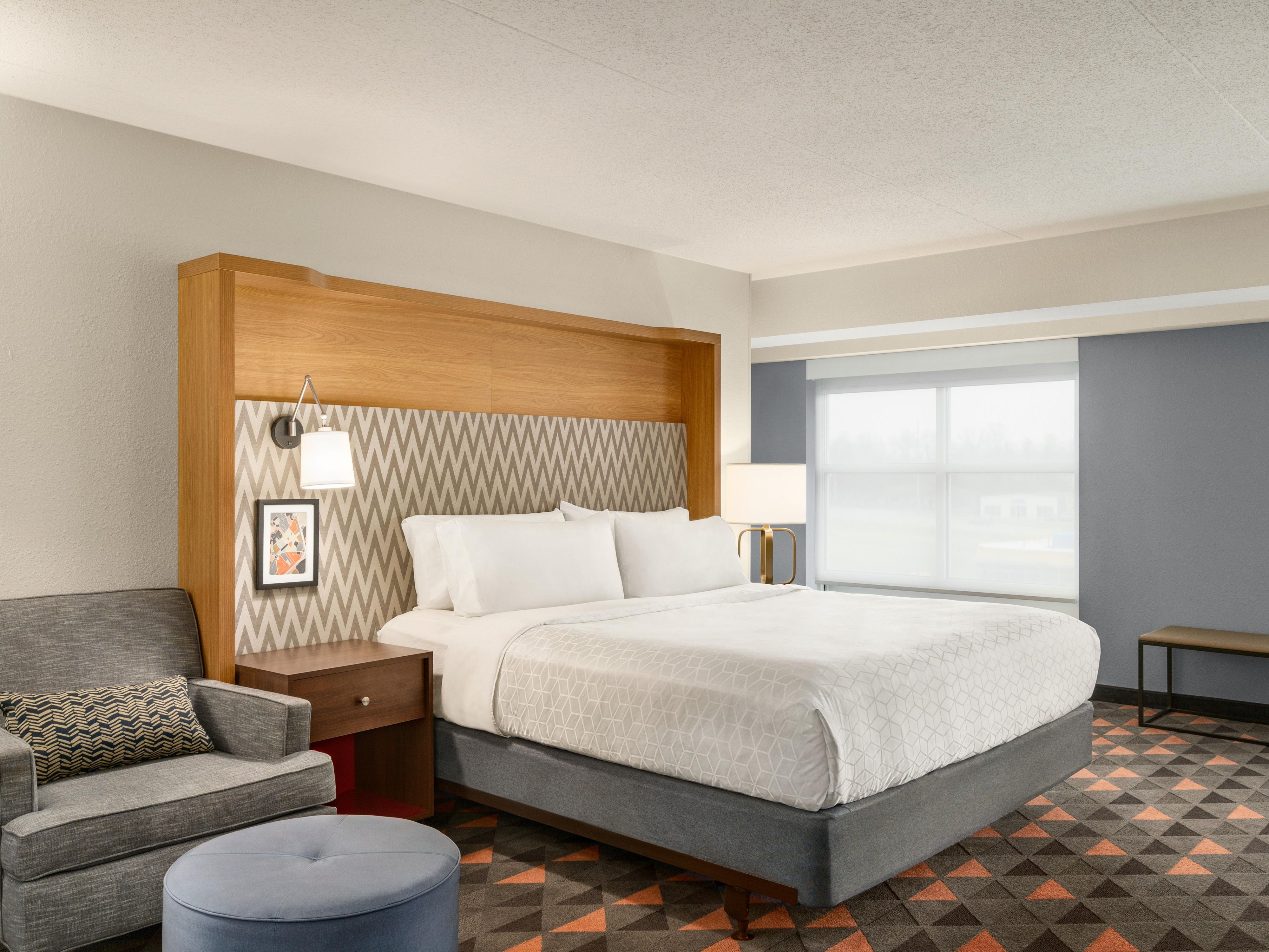Sink into plush bedding in our spacious king bed guest room.