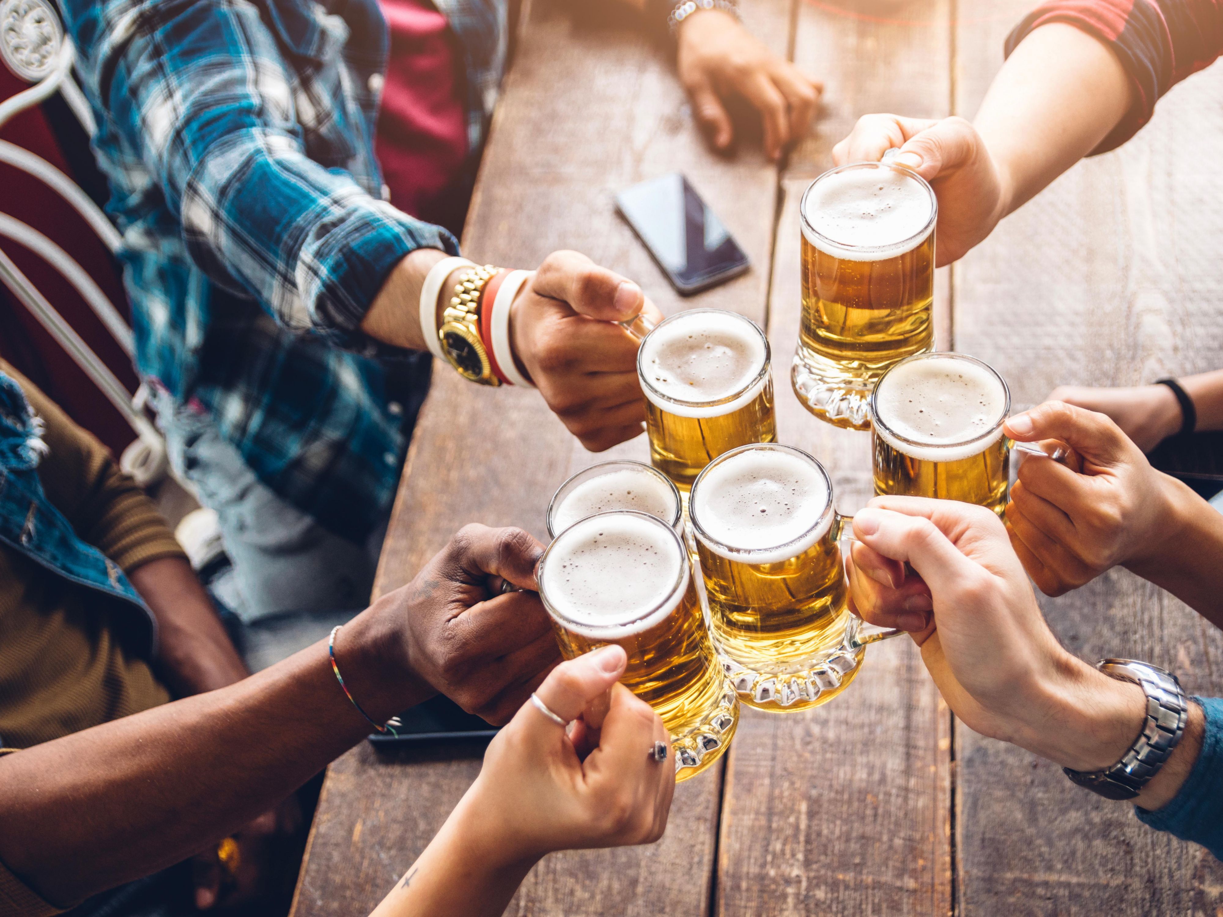 Friends giving a cheers with beers! 