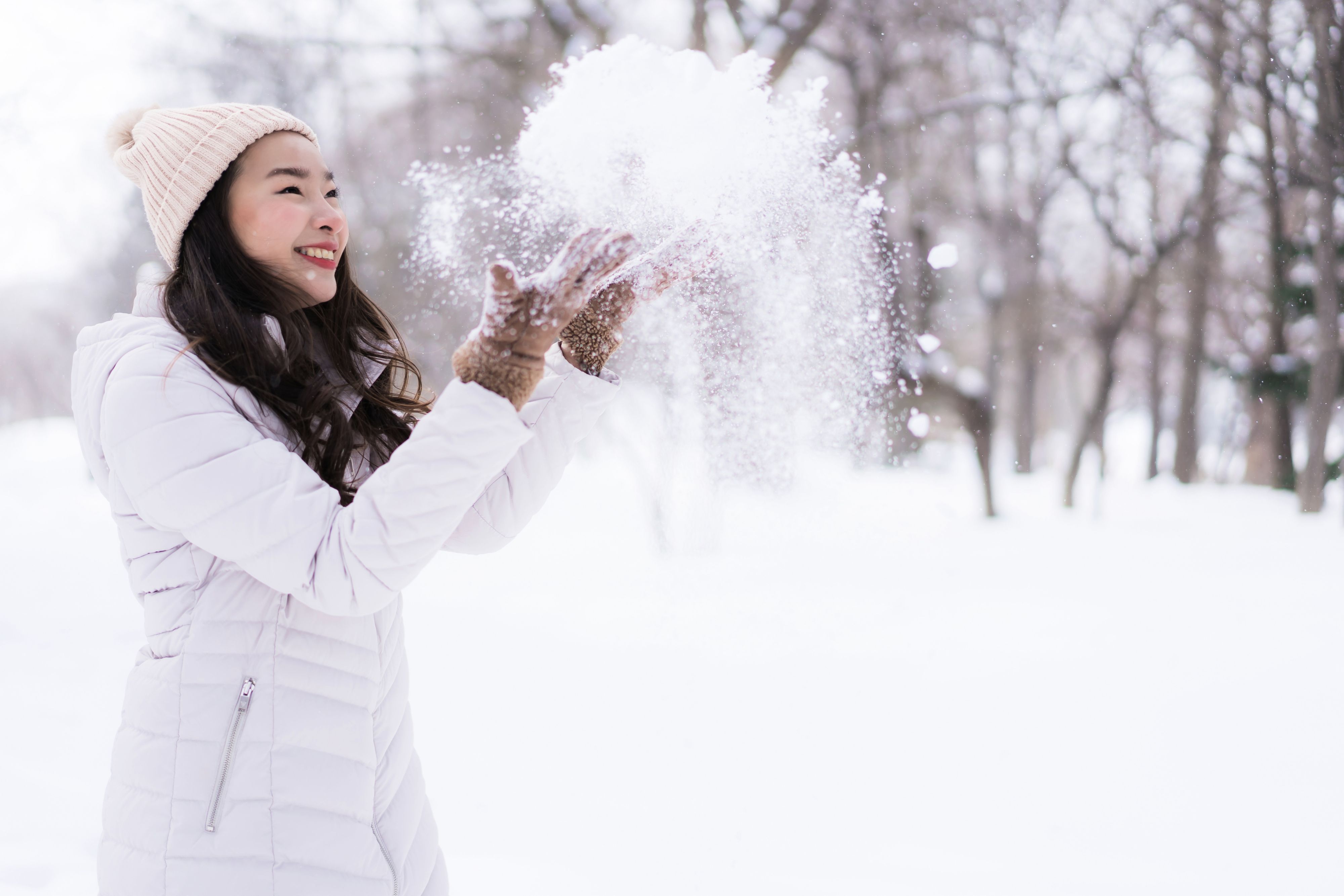 Woman playing in snow
