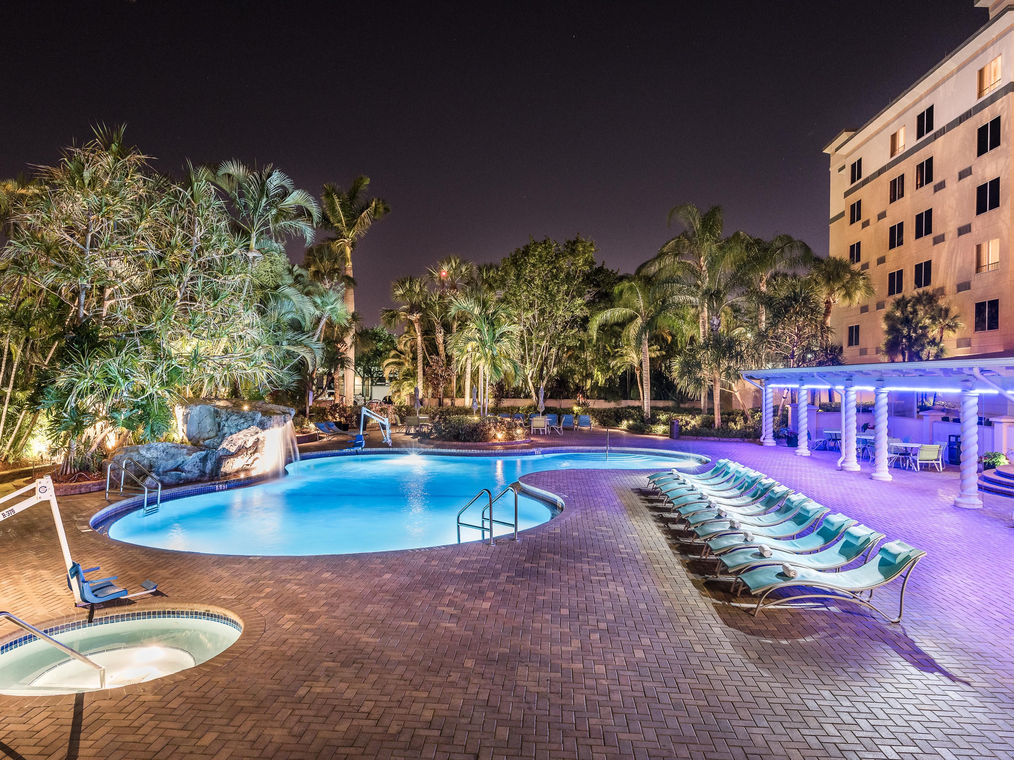 Relax in our spacious pool area featuring a soothing waterfall and lush tropical surroundings. Enjoy comfortable lounge chairs, a stylish terrace bar serving refreshing drinks, and an inviting hot tub. Whether unwinding or hosting a private event, our pool area is the perfect backdrop for unforgettable moments!