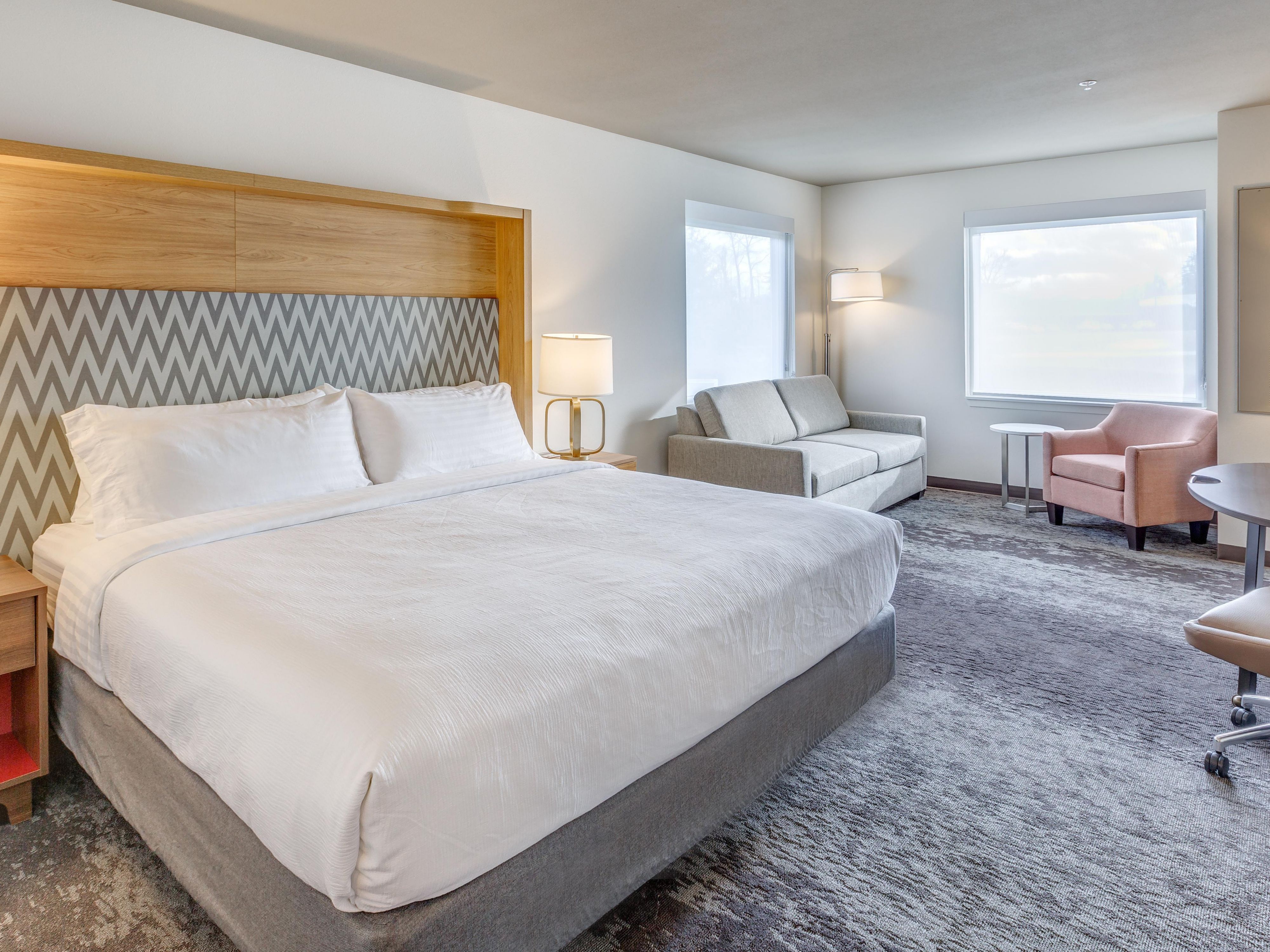 Our spacious king suite features a sitting area and sleeper sofa.