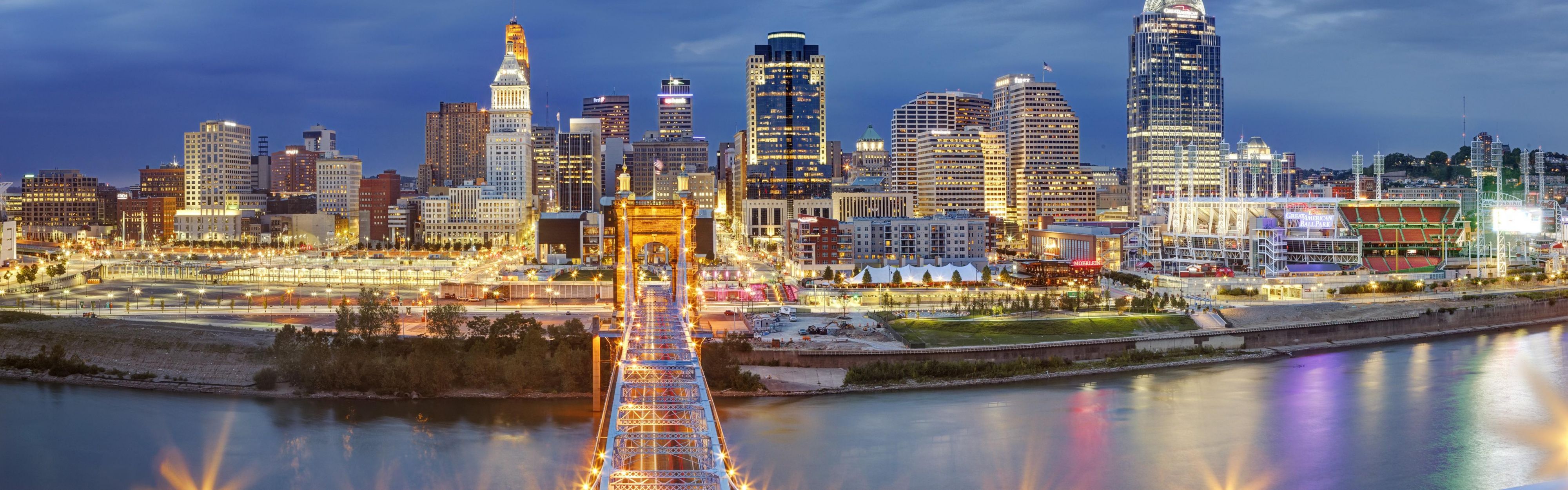 Discover the vibrant skyline and lights of Downtown Cincinnati