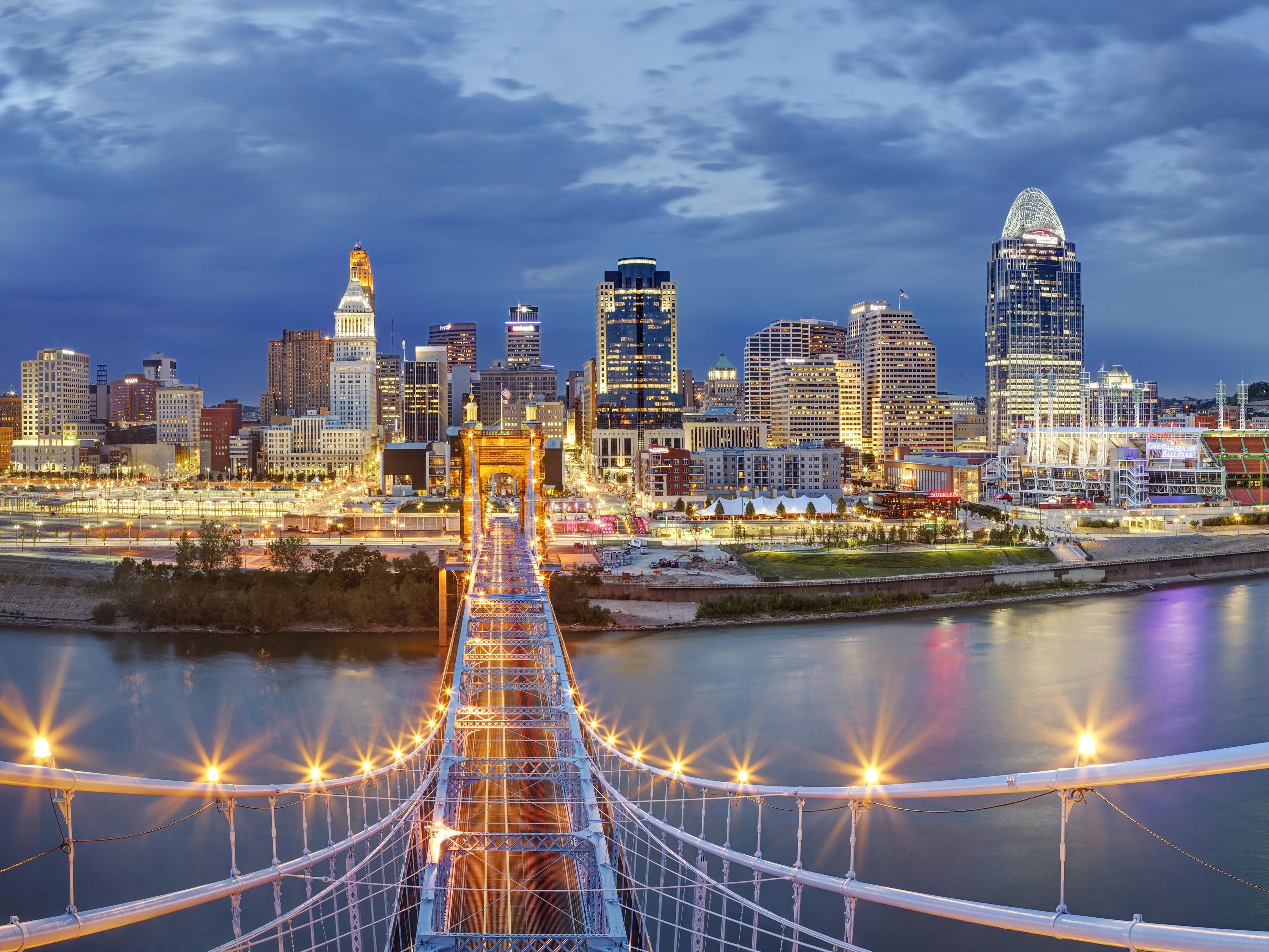 Discover the vibrant skyline and lights of Downtown Cincinnati