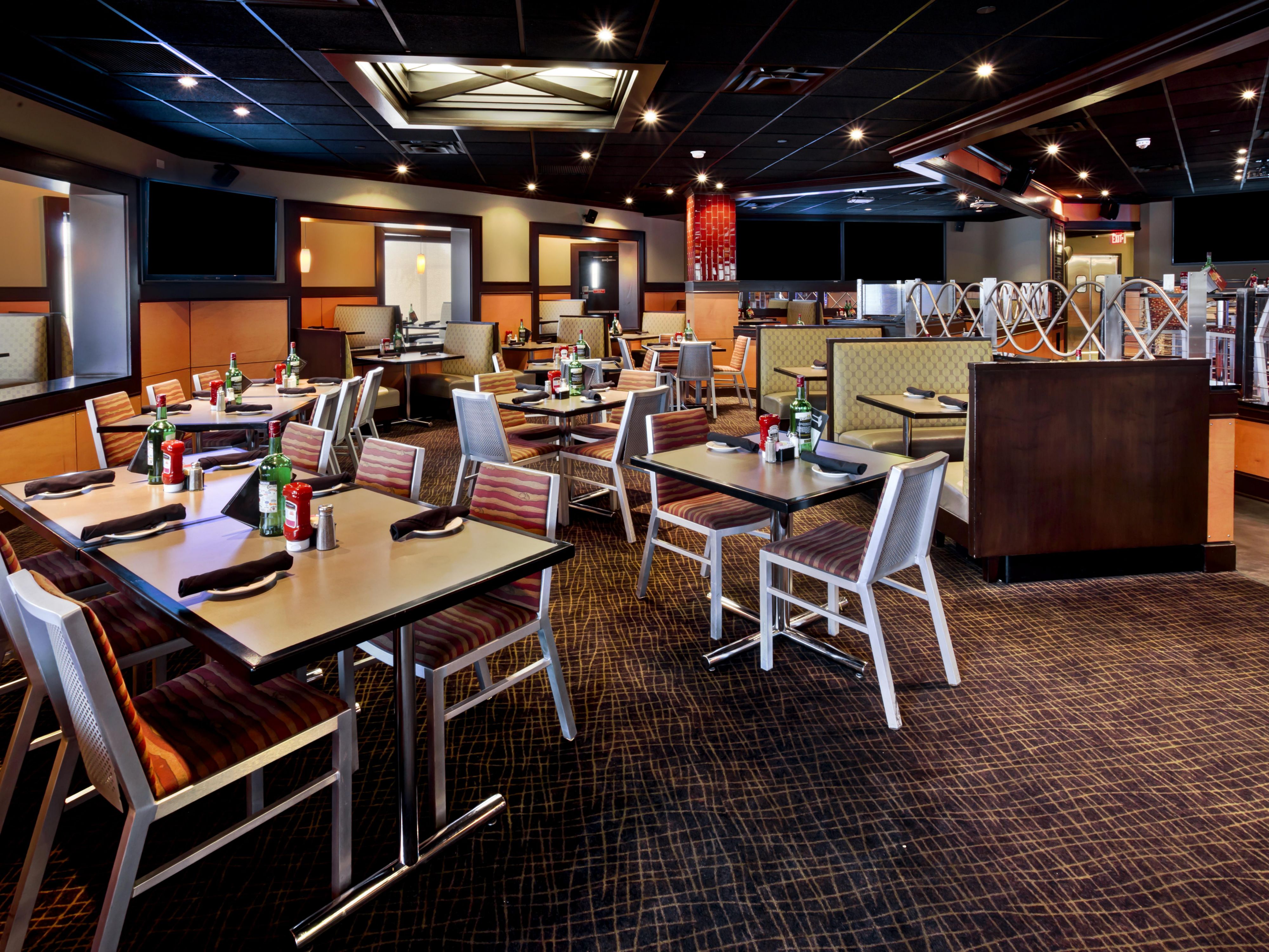 Hungry? Come visit and see our complete remodel! We've included a VIP lounge, 27 TVs, 4 Hi-Def 90" projection TVs, a brand new music system and a fantastic, inviting bar! Don't miss out on these legendary changes. Stop by and see what all the buzz is about!