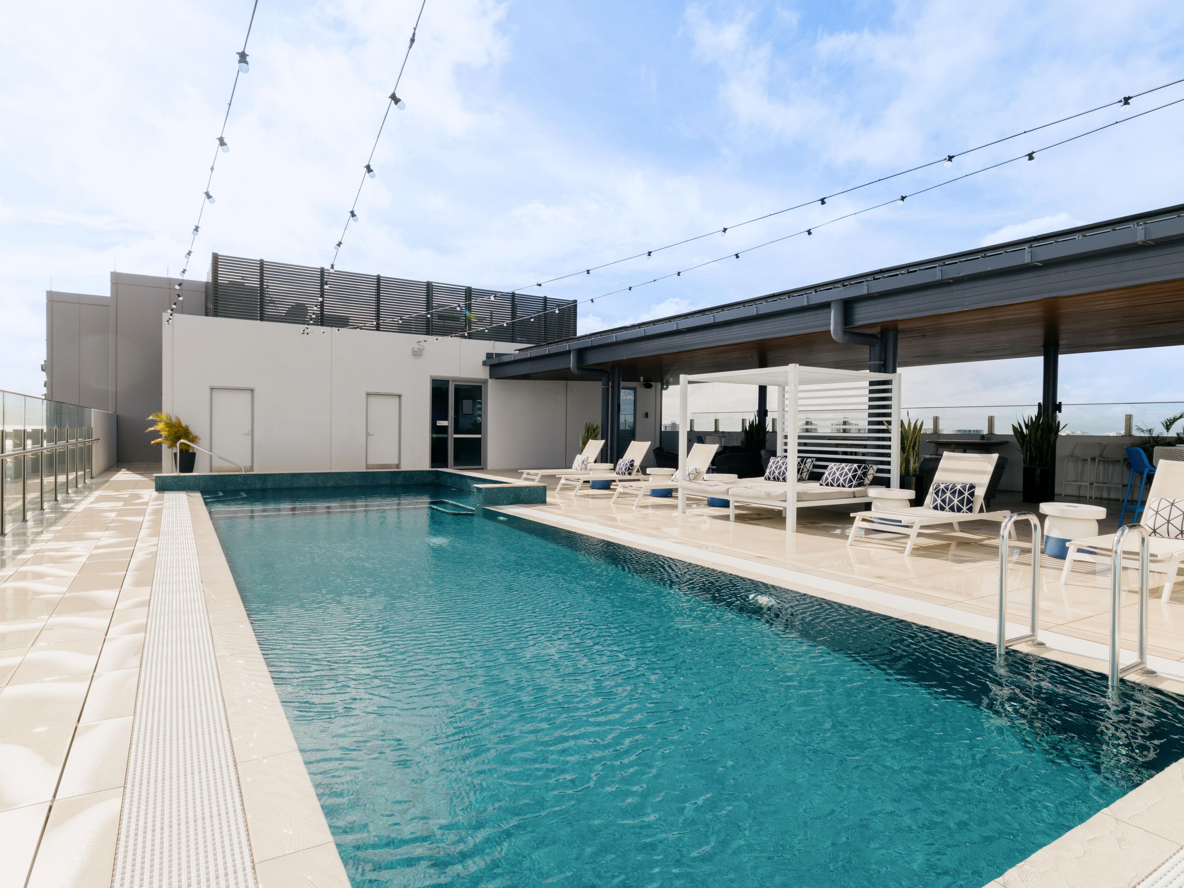 Versatile rooftop pool space with modern decor
