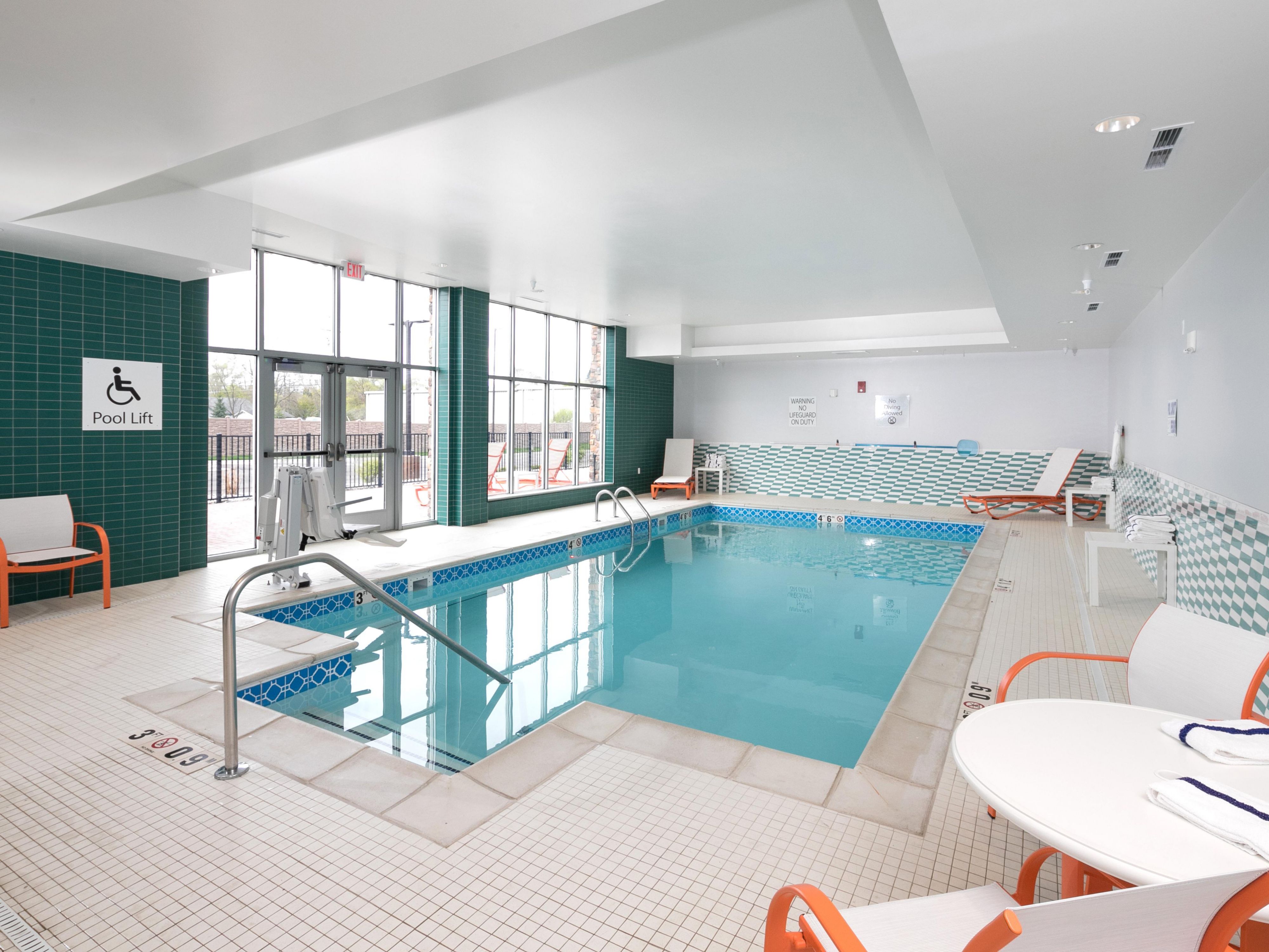 Relaxing heated pool, door access to outdoor patio, lounge chairs