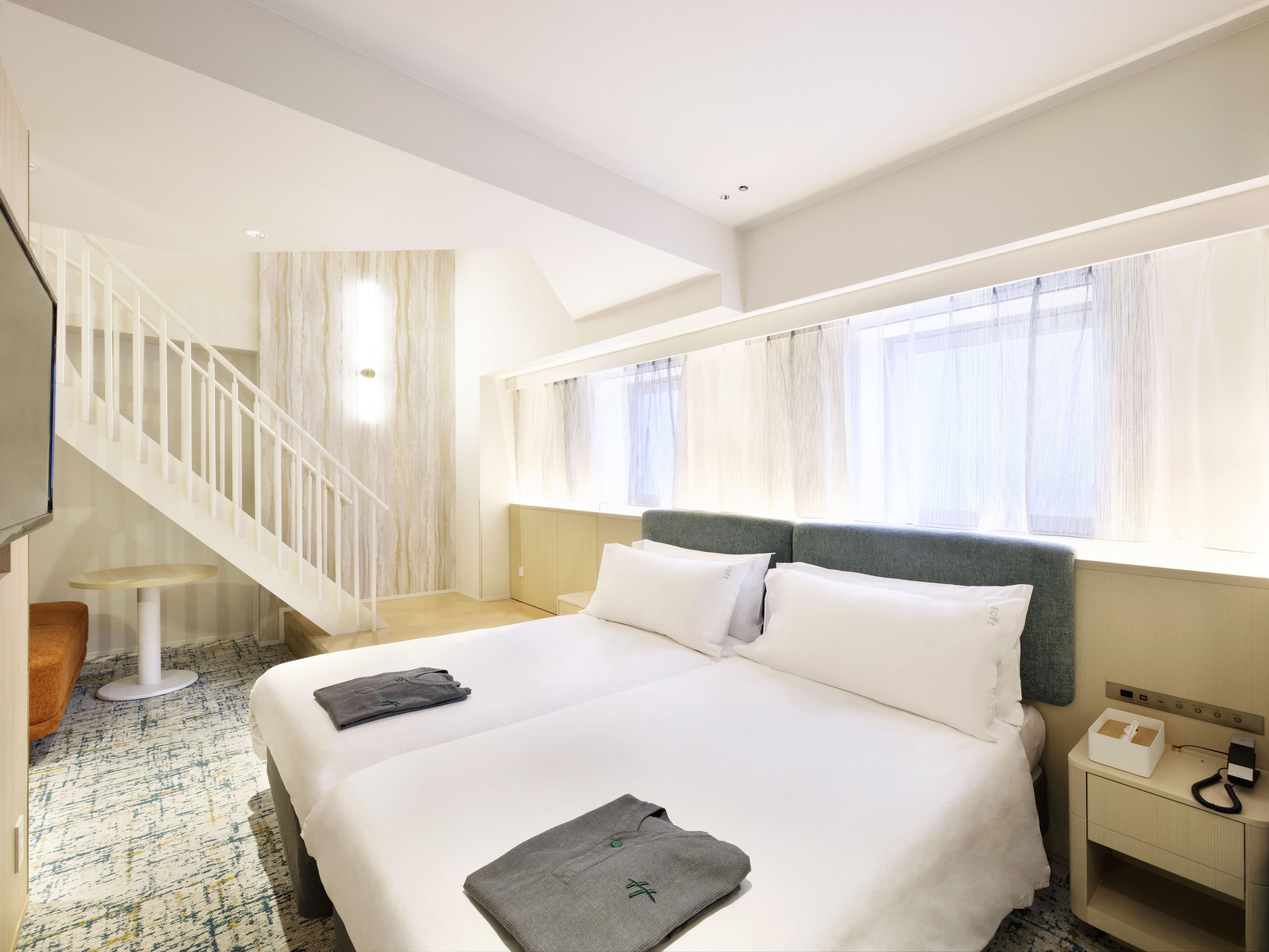 Our thoughtfully designed guest rooms blend simplicity and comfort, featuring complimentary Wi-Fi and Simmons beds for a restful night's sleep. With options ranging from standard rooms to spacious suites, we cater to all travel needs, making longer stays more enjoyable. Experience a relaxing space that enhances your journey.