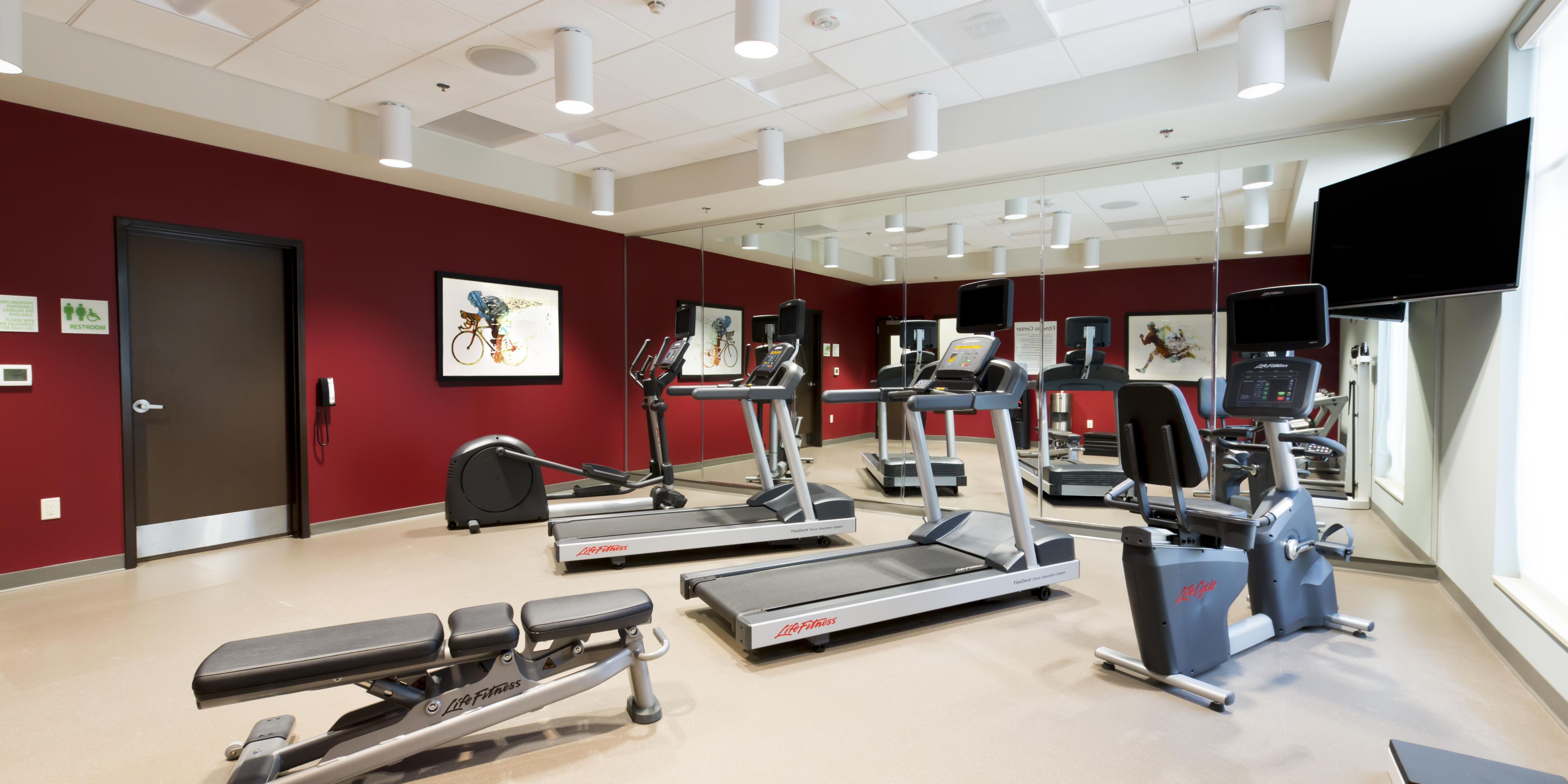 Head to our hotel's Fitness Center to stay on top of your fitness routine while traveling. Our gym is open 24/7 and features state-of-the-art fitness equipment, including ellipticals, treadmills, stationary bikes, and free weights. Once you're done working out, take a refreshing dip in our heated outdoor pool and a relaxing soak in the hot tub.