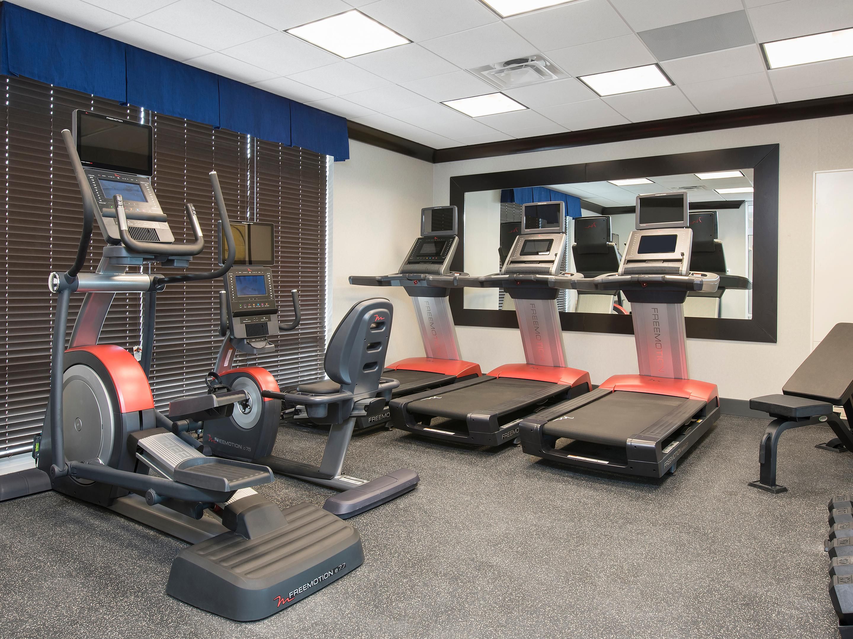 Modern Fitness Center open 24-7 featuring state of the art equipment. 