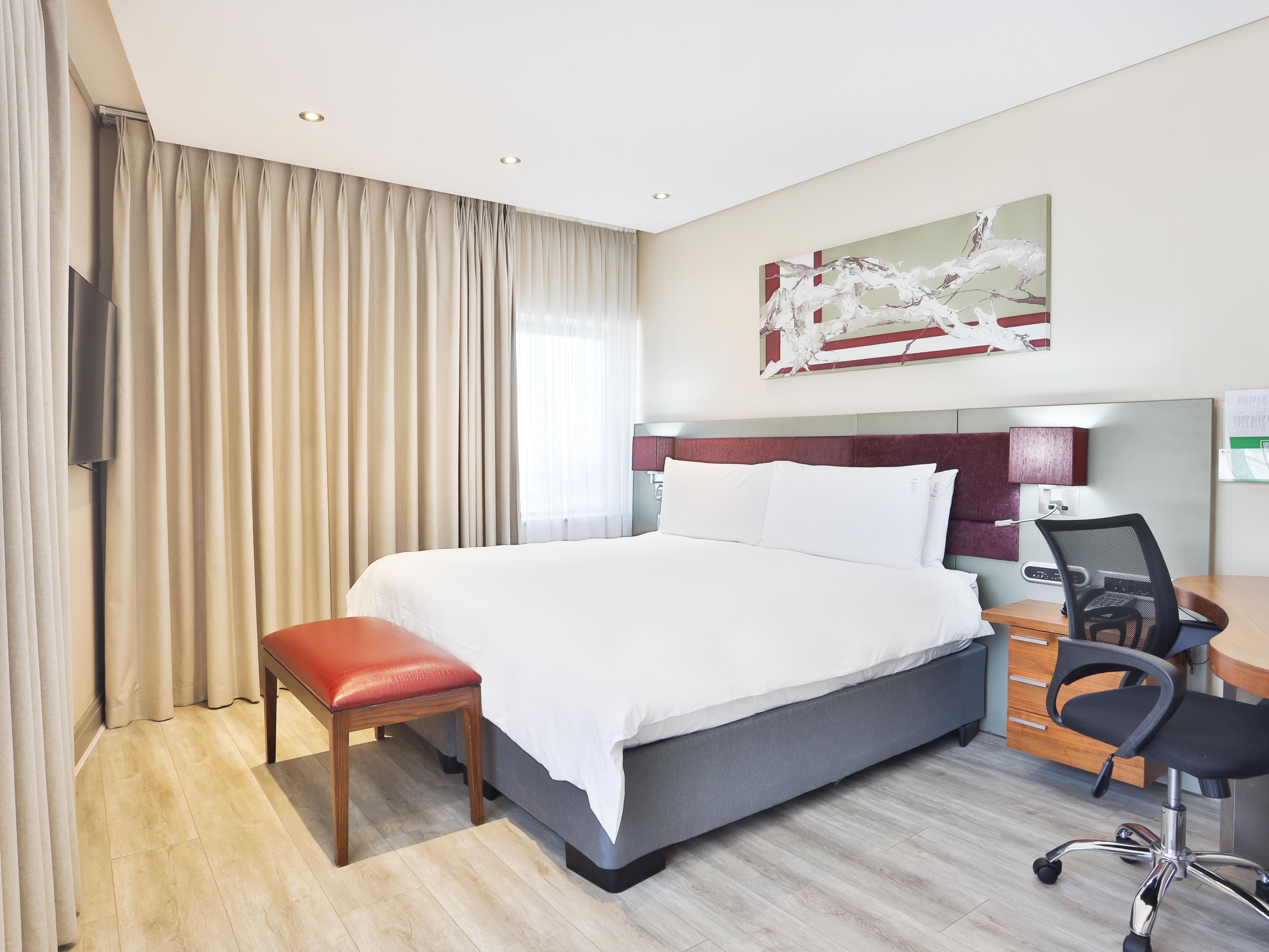 Modern Queen guest room with working space