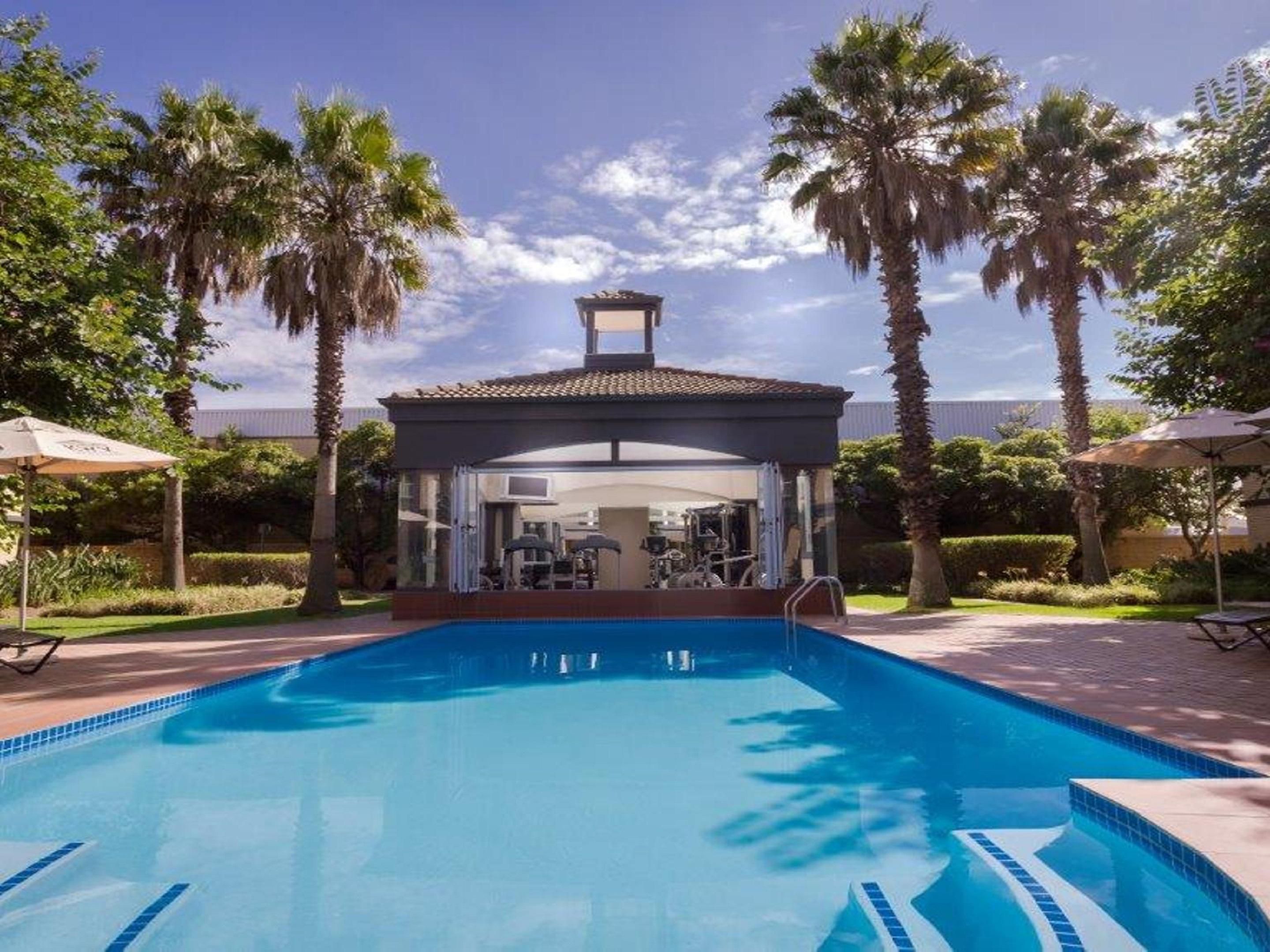 What is better than a sparkling blue pool? A modern Fitness Centre facing onto a sparkling blue pool. Soak up the sun in style.