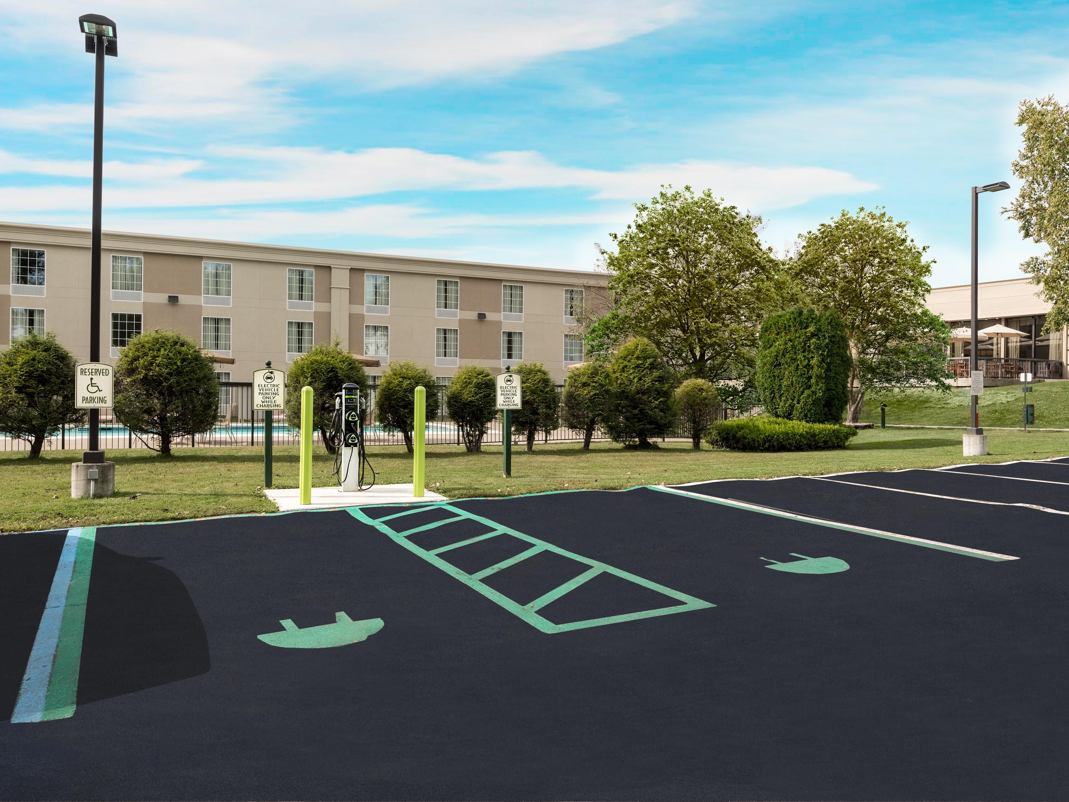 Large parking area that offers free parking for guests. 5 available EV charging stations. We offer the only guest parking in the area that can accommodate larger vehicles such as tractor trailers, fleet vehicles, and charter buses/vehicles for those attending banquets and a myriad of other venues.