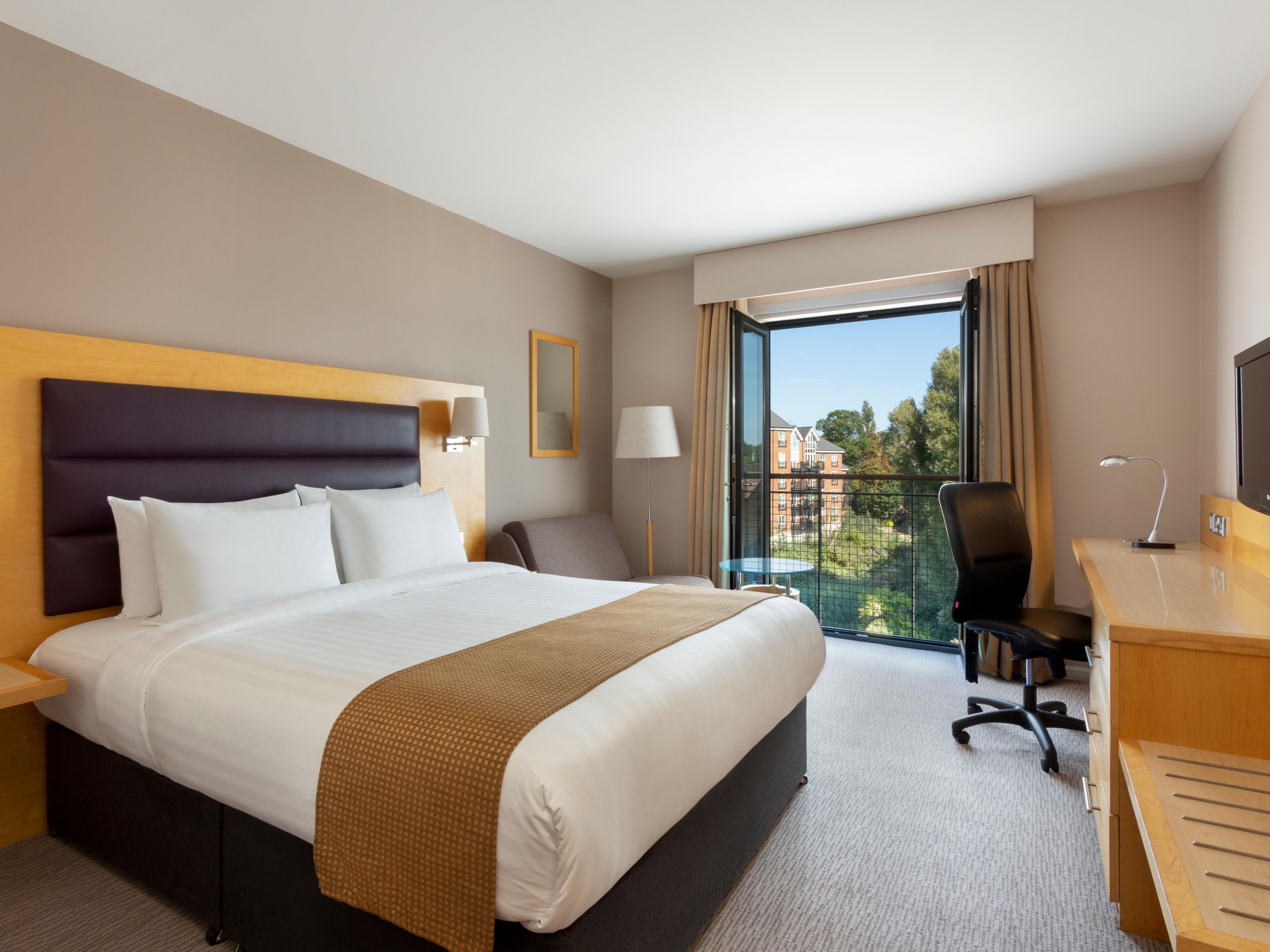 Enjoy a relaxing summer break in our premium room with balcony overlooking the lock.