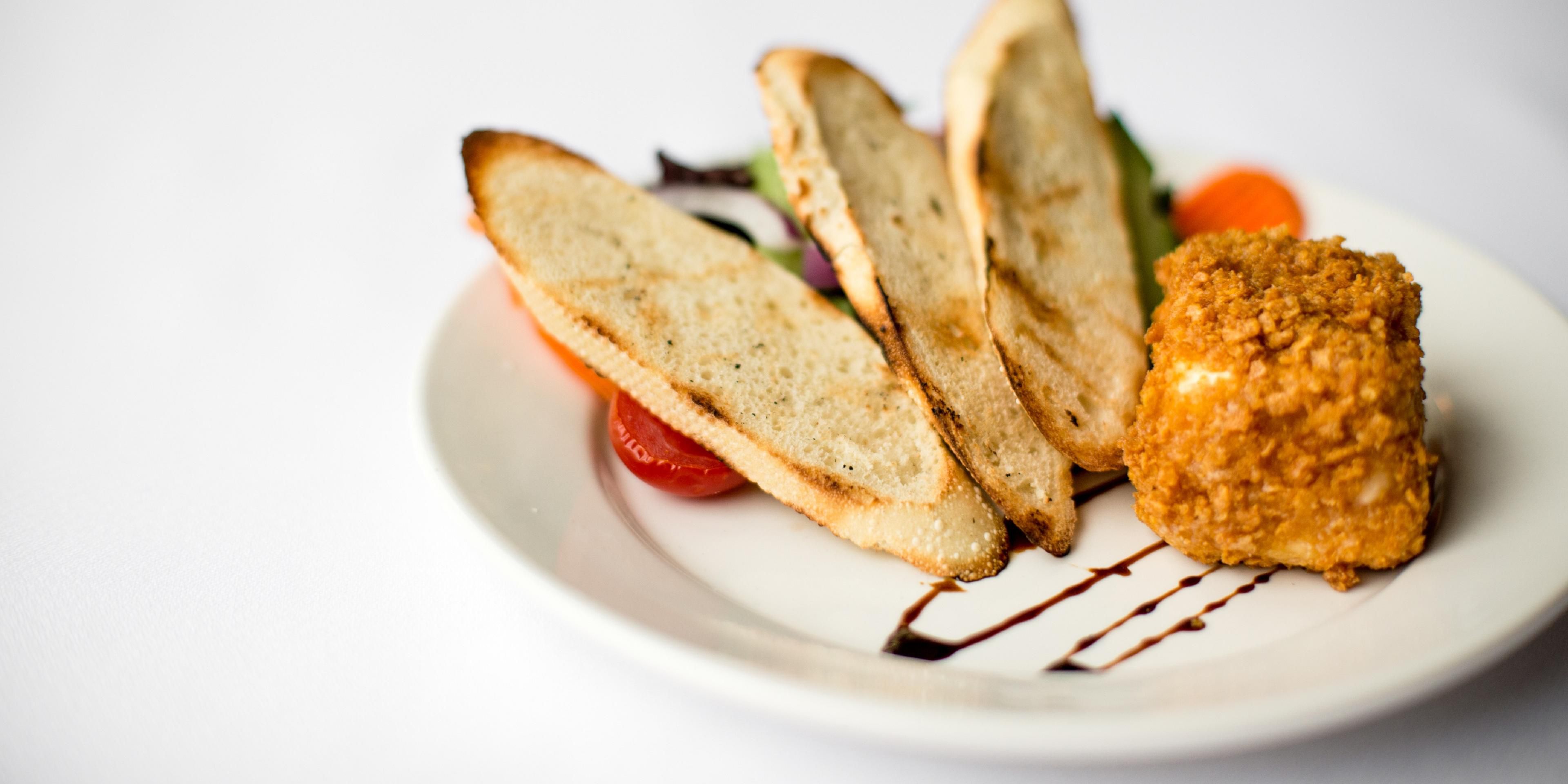 a tasty appetizer of breaded &amp; fried brie